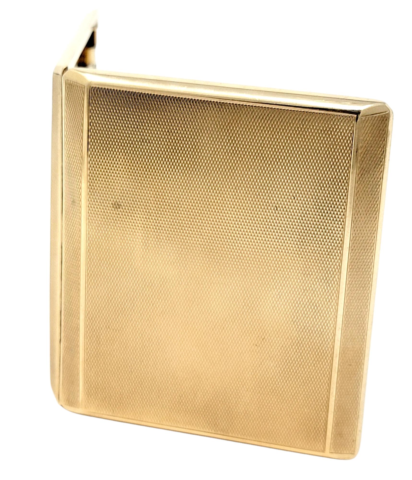 Take home a piece of history! This incredible antique hinged cigarette case is made of solid 9 karat yellow gold and features a finely textured finish throughout with a secure box clasp closure. The sleek, compact design allows for easy access and