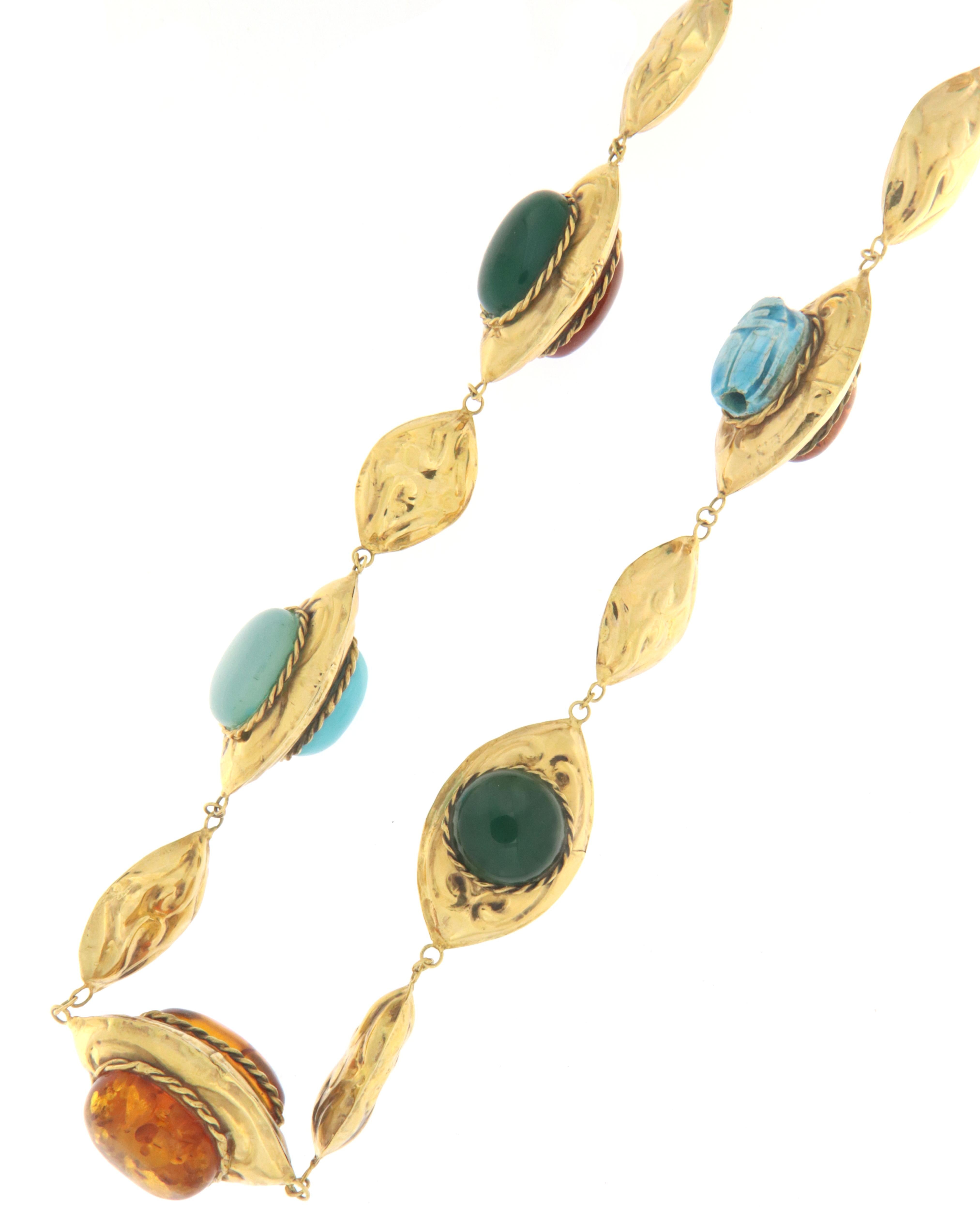 Fantastic antique necklace in 9 karat yellow gold handmade in 1900 by ancient Neapolitan jewelers, of Italian manufacture, mounted with beautiful stones in turquoise, green agate, amber, coral and topaz

Necklace total weight 112.60 grams
