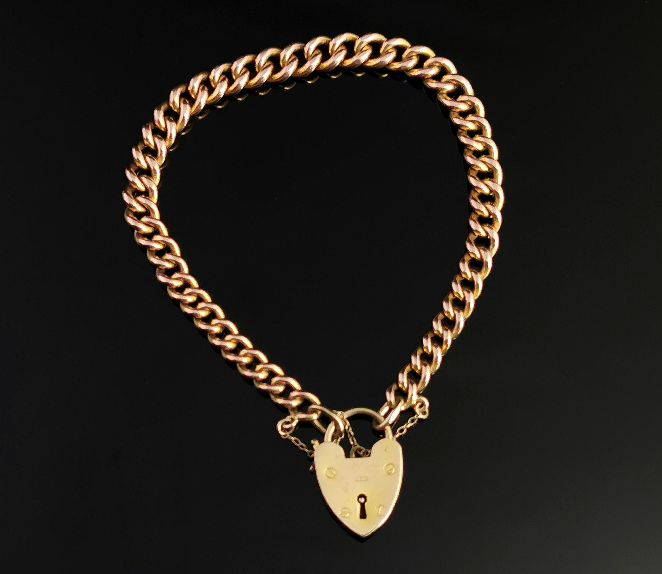 A beautiful antique, Edwardian era 9ct gold solid curb bracelet. 

Graduated rich gold curb links, each individually stamped for gold. 

They are joined by a later 9ct gold heart shaped padlock clasp which is fully hallmarked for London 1965, 9ct