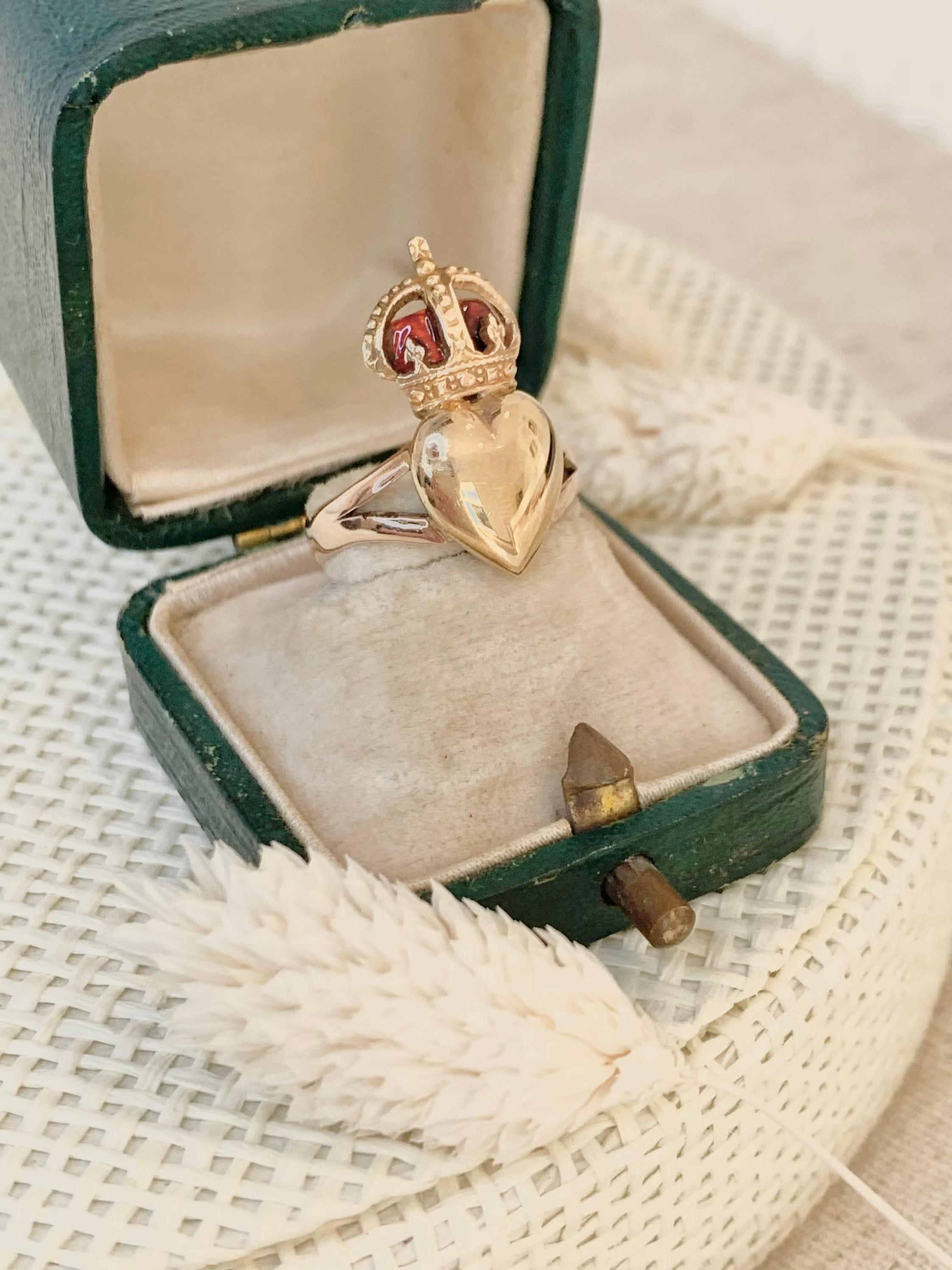 Antique Crowned Heart Ring

Victorian Circa 1880

9ct Gold

Beautiful Gold Heart with Red Enamel & Gold Crown
Measures Approx Height 21mm & 9.2mm Wide 

UK Size K

US Size 5 1/2

Would Make a Fabulous Pinky Finger Ring

Can be resized using our