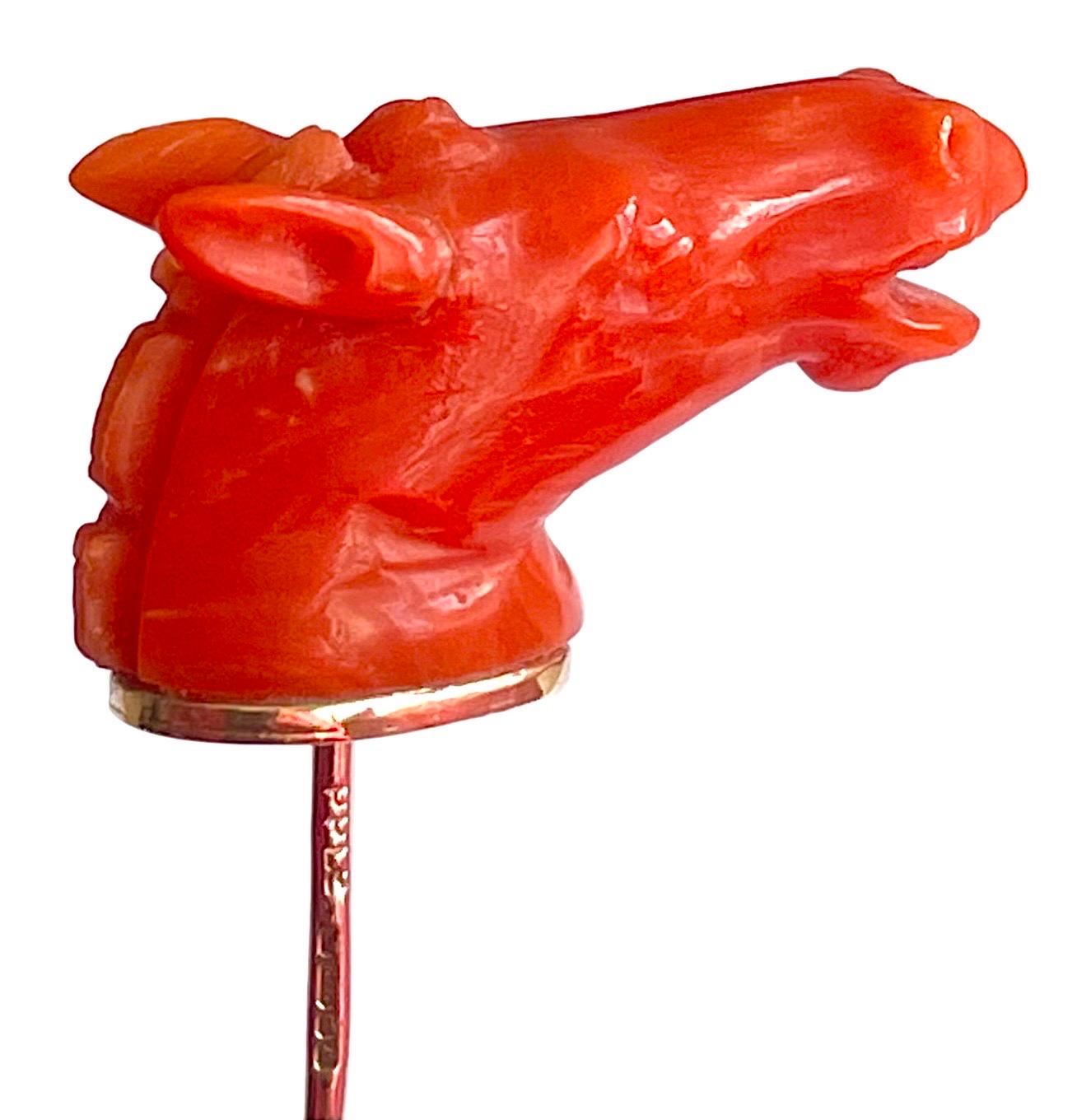Superb antique stick tie pin featuring a carved coral horse head set in 9 carat yellow gold, in original box.
The pin was designed to keep ties in place and prevent the tie from flapping around or getting dipped into food. Today, they are considered