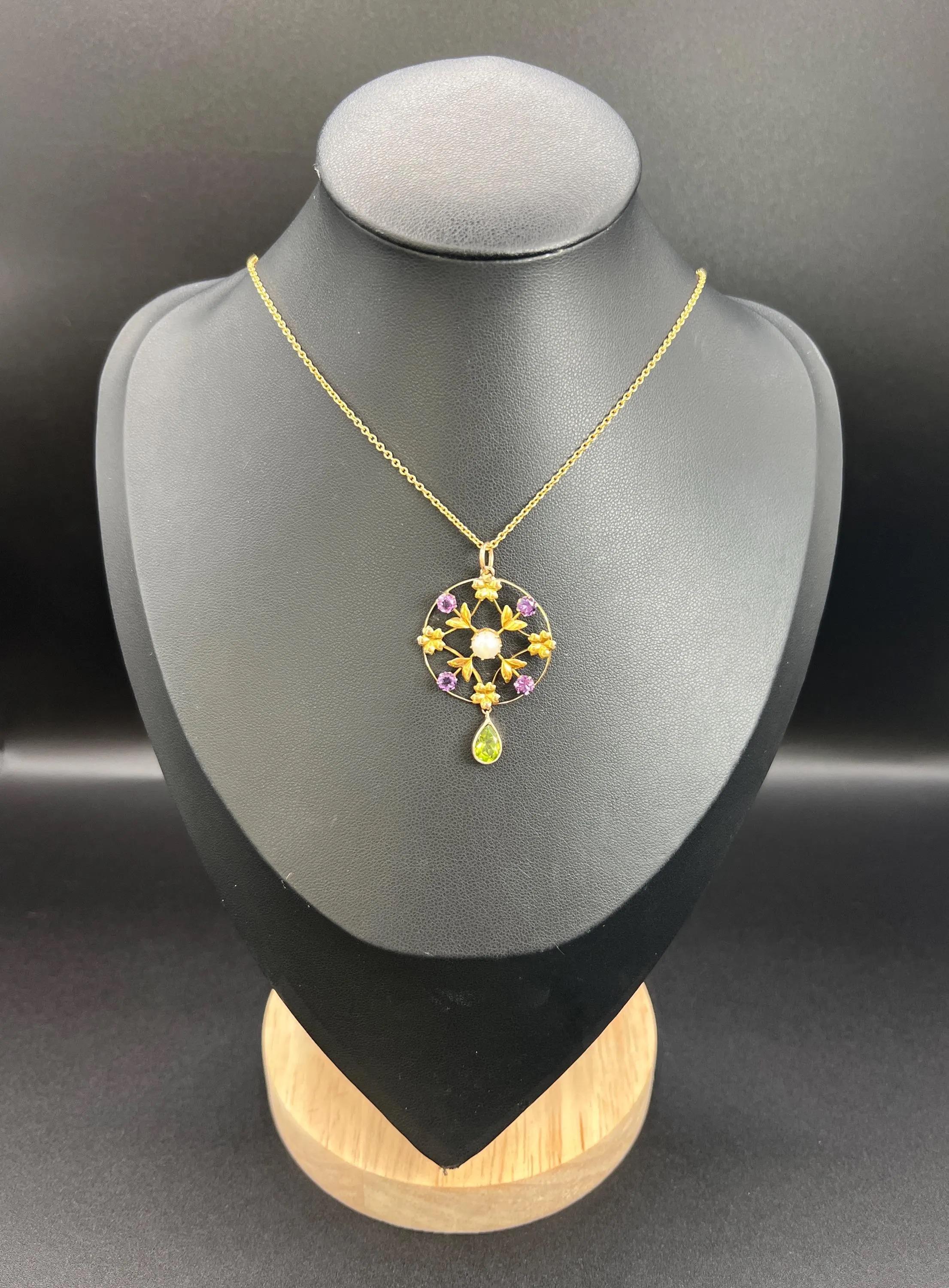 Antique Suffragette Pendant

9ct Gold

Circa 1910

*THE CHAIN IS SOLD SEPARATELY

This exquisite 9ct yellow gold pendant captures the elegance of the Edwardian era with its stunning open work, circular design. Adorned with the vibrant colours of the