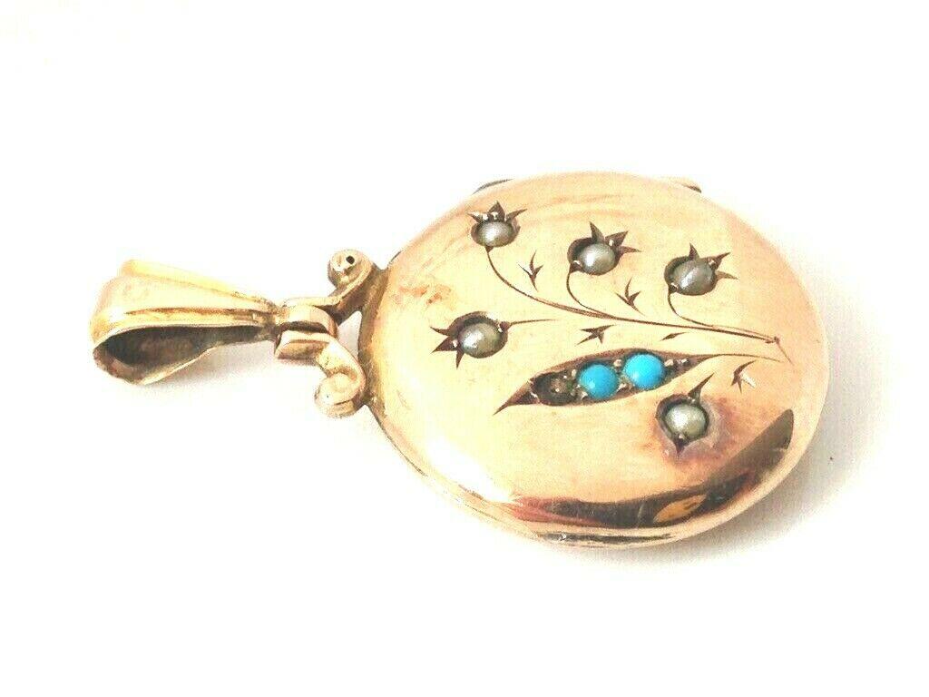 Beautiful Sealed - unable to open
9ct Gold round Momento Locket
dated 1904 
with a floral front design adorned with seed pearls and turquoise
* one turquoise cabochon is missing 
and high decorative bail.
Size of Locket without bail 
Diameter is