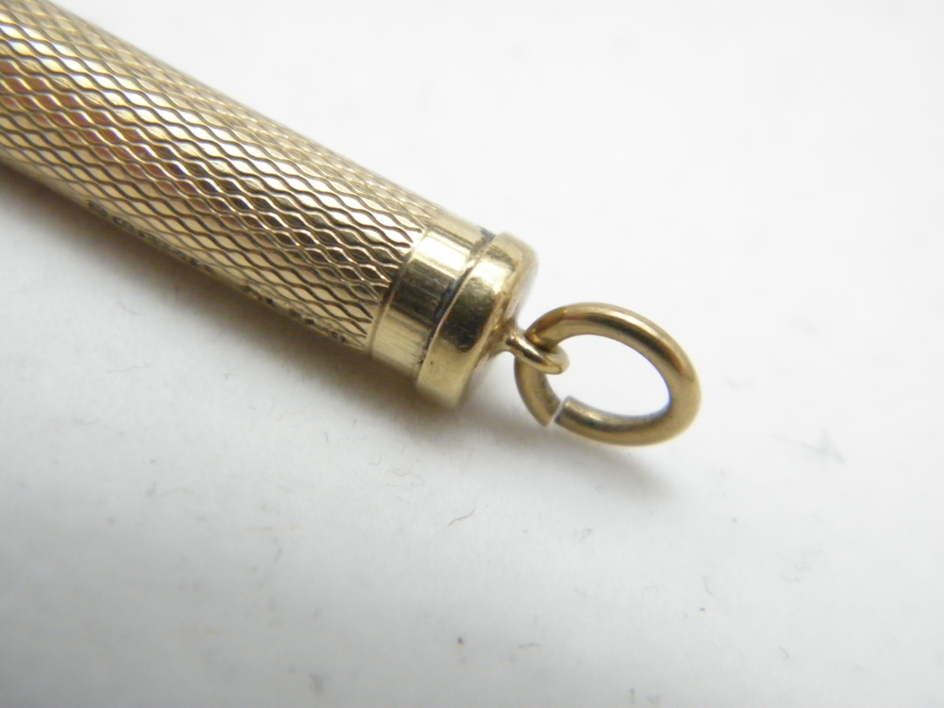gold toothpick with diamond
