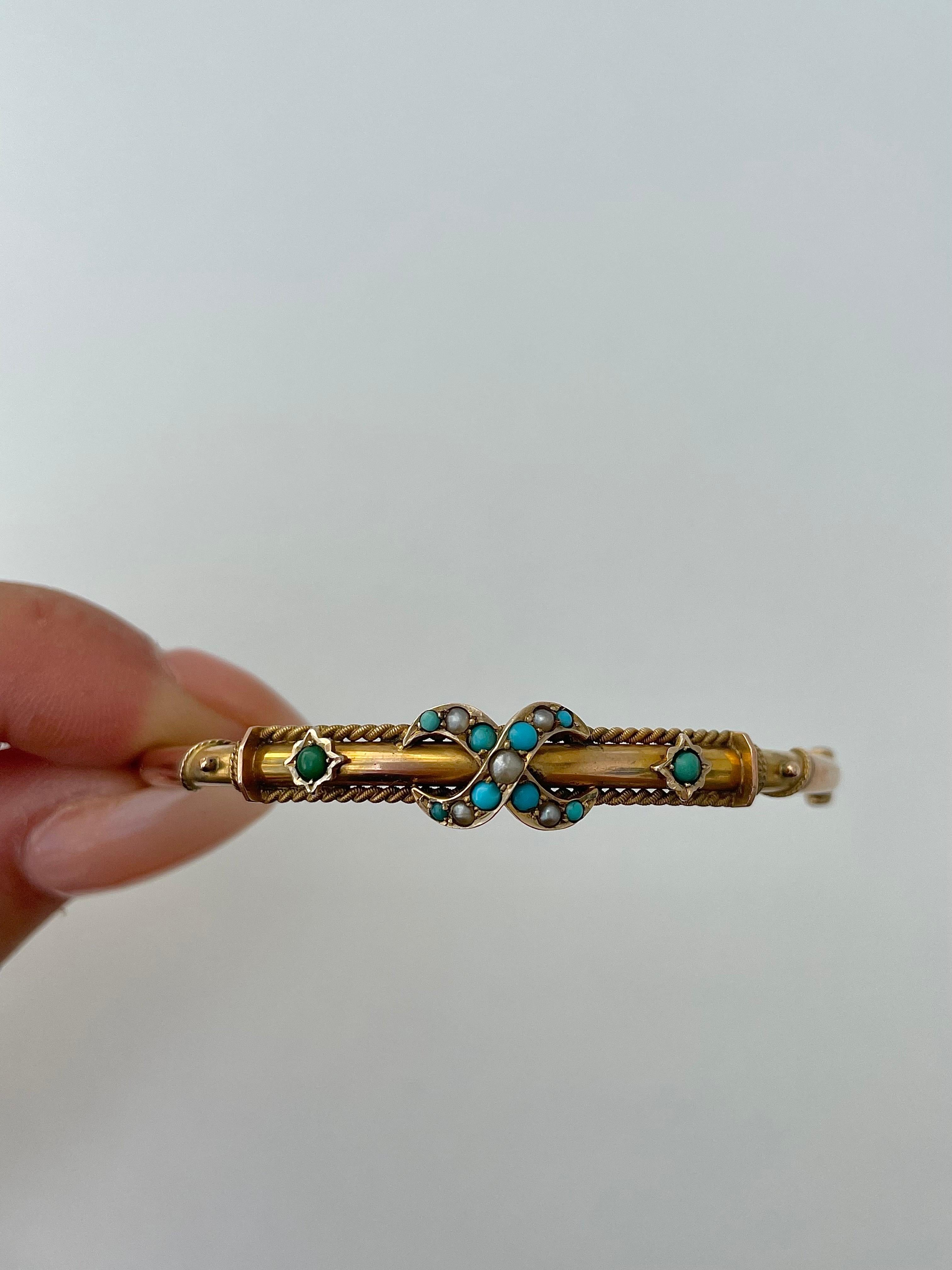 Antique 9ct Gold Turquoise and Pearl Cross Over Bangle Bracelet 

charming and beautiful bangle, the detailing is just gorgeous!


The item comes without the box in the photos but will be presented in a gift box

Measurements: weight 6.82g, inner