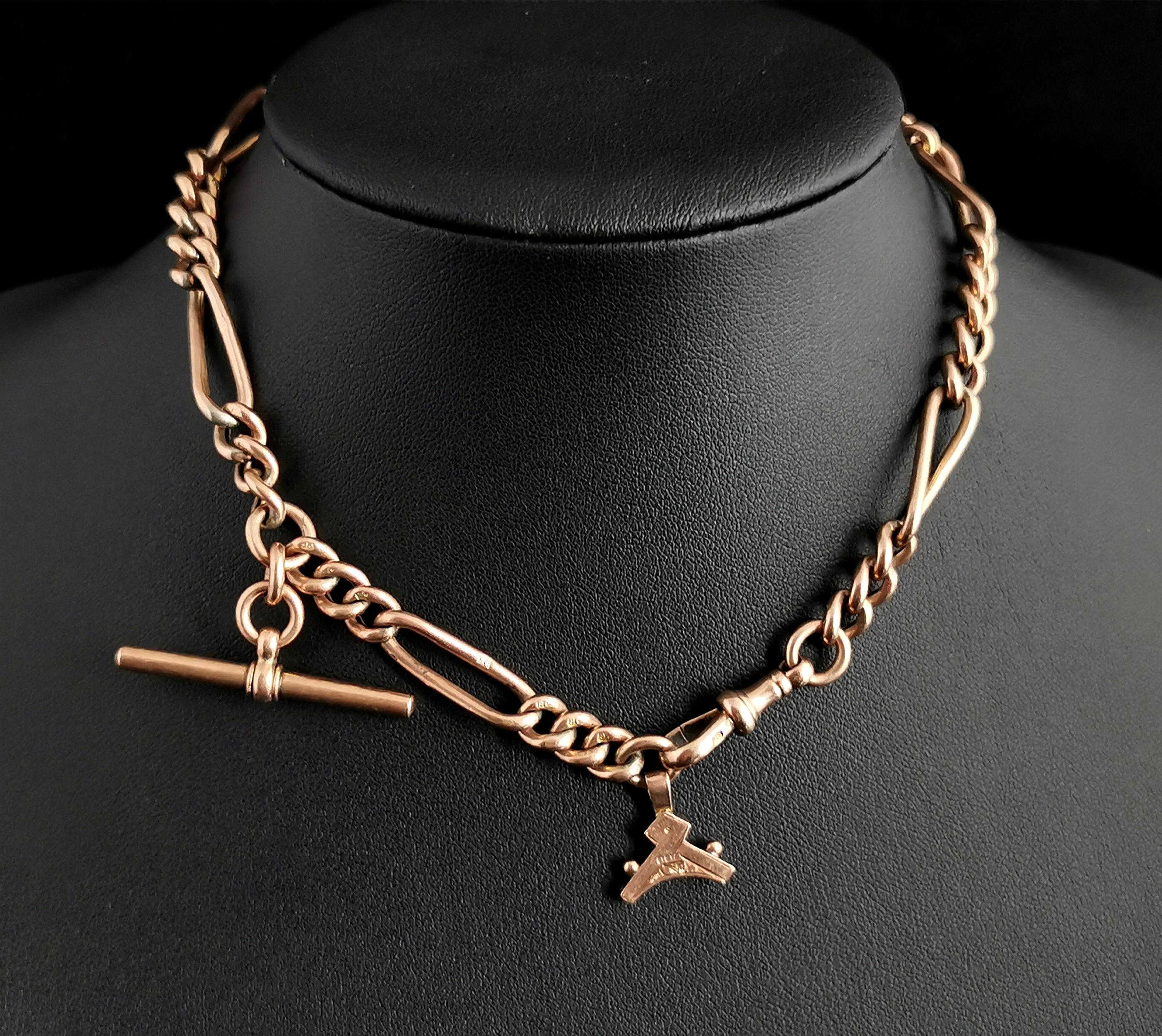 A handsome antique Edwardian era 9 karat Rose gold Albert chain or watch chain.

It has an attractive trombone link design with elongated paper clip links intercepted by short sections of curb link, each link is stamped 9c.

It has a gold t bar and