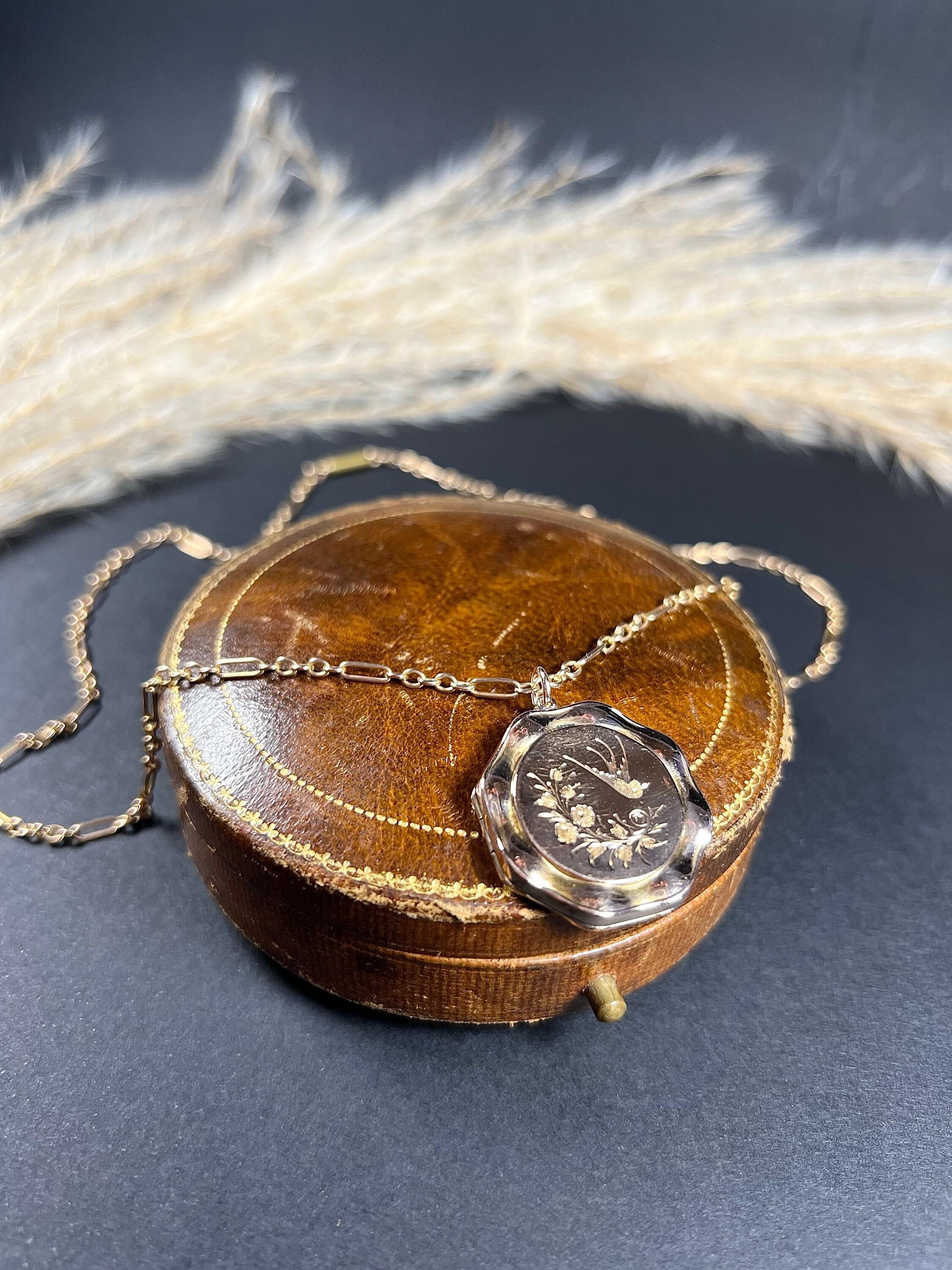 Antique Gold Swallow Locket

9ct Rose Gold Back & Front Stamped

Circa 1900

This is a stunning Edwardian round shaped locket, with a 9ct rose gold back and front. It is delicately engraved with a swallow and floral motif on both sides and a