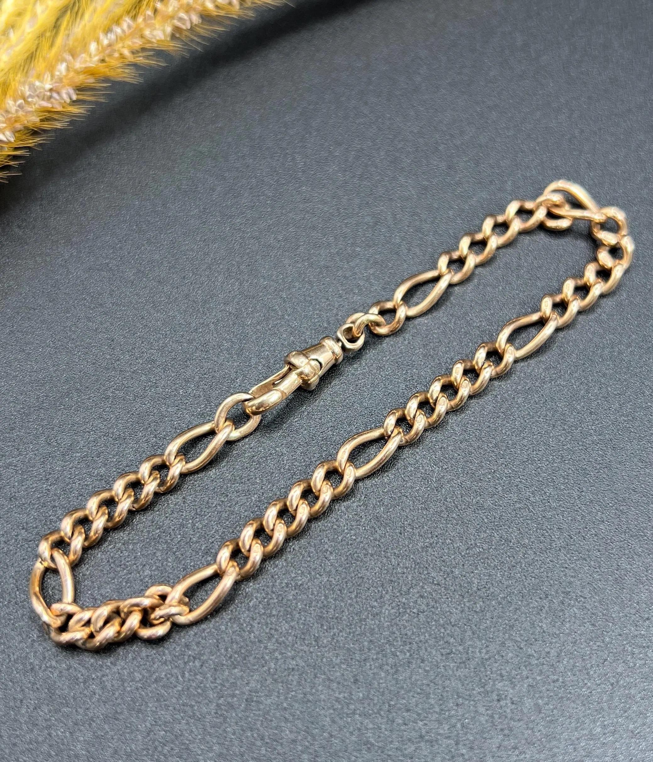 Antique Gold Bracelet 

9ct Gold

Circa 1910

This exquisite Edwardian fancy Figaro link bracelet is crafted from 9ct rose gold. Its unique design and intricate craftsmanship make it a true work of art. The bracelet features a swivel clasp