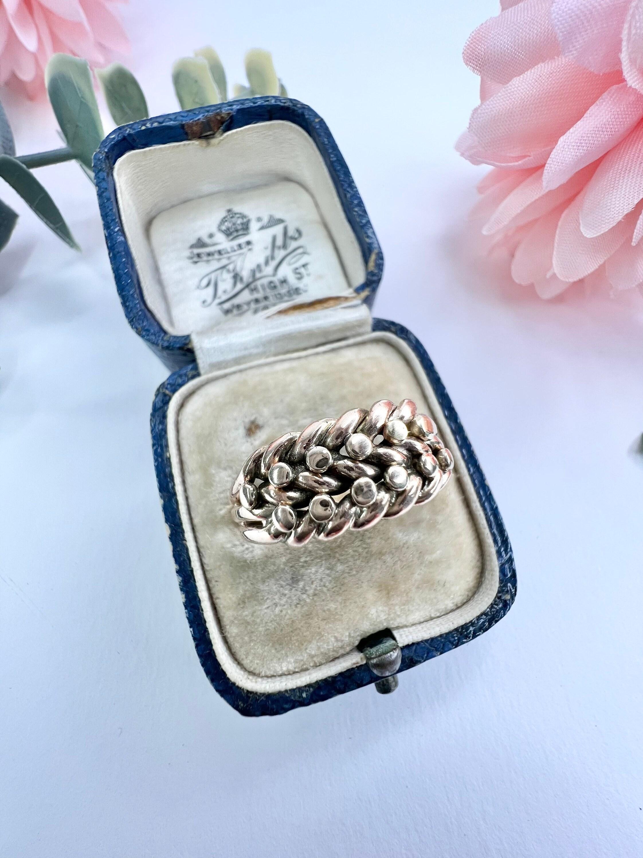 Antique Keepers Ring 

9ct Rose Gold Stamped 

Hallmarked Chester 1901

Makers Mark G V E B

Lovely, Chunky Edwardian Two Row Keepers Ring. A Keeper Ring Was Traditionally Used Alongside Another More Valuable Ring To Keep It Securely In Place.