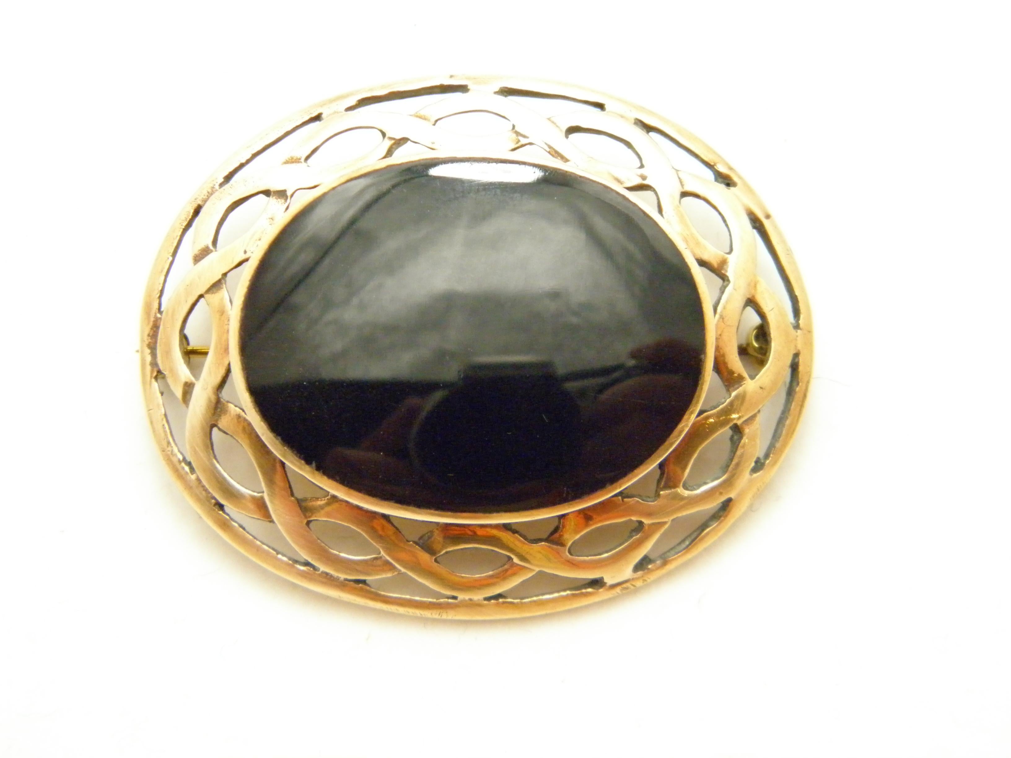 If you have landed on this page then you have an eye for beauty.

On offer is this gorgeous

9CT HEAVY ROSE GOLD ONYX CELTIC MOURNING BROOCH

DETAILS
Material: 9ct (375/000) Solid Yellow Rose Gold (typical colour of the era)
Style: Victorian classic