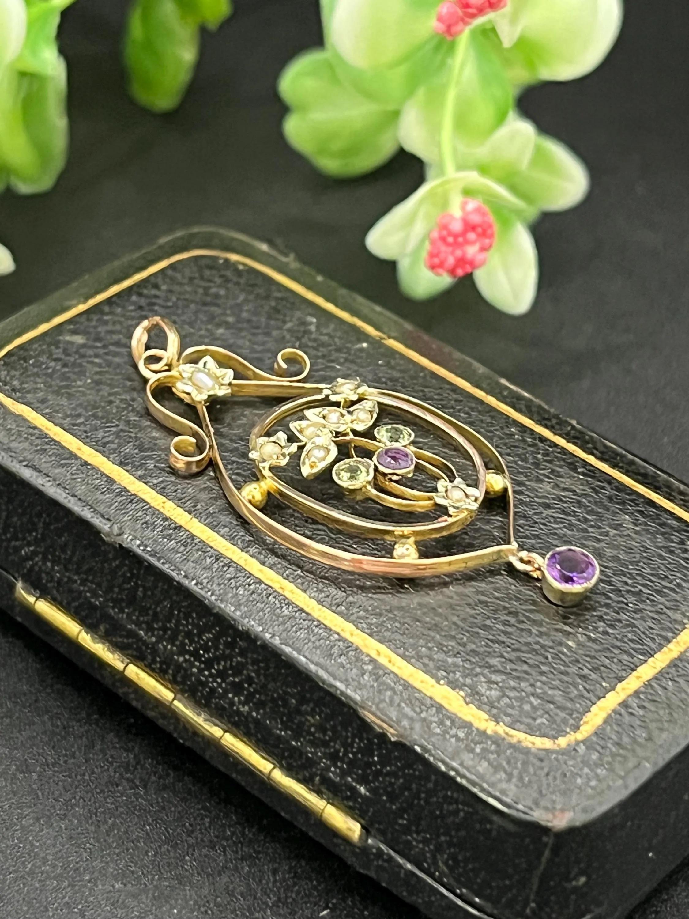 Antique Suffragette Pendant

9ct Rose Gold

Circa 1910

*The chain is sold separately

Crafted in 9ct gold, floral curves cradle pearls, peridots, and amethysts in the iconic suffragette palette: green for hope, white for purity, and purple for