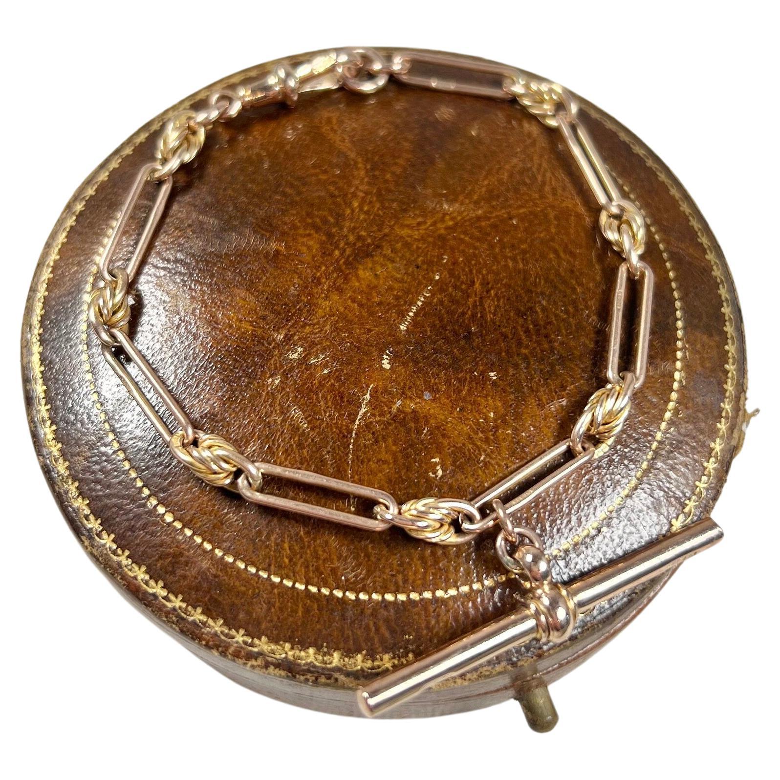 Antikes 9 Karat Roségold gestempeltes, edwardianisches Trombone & Knot Link Albert-Armband