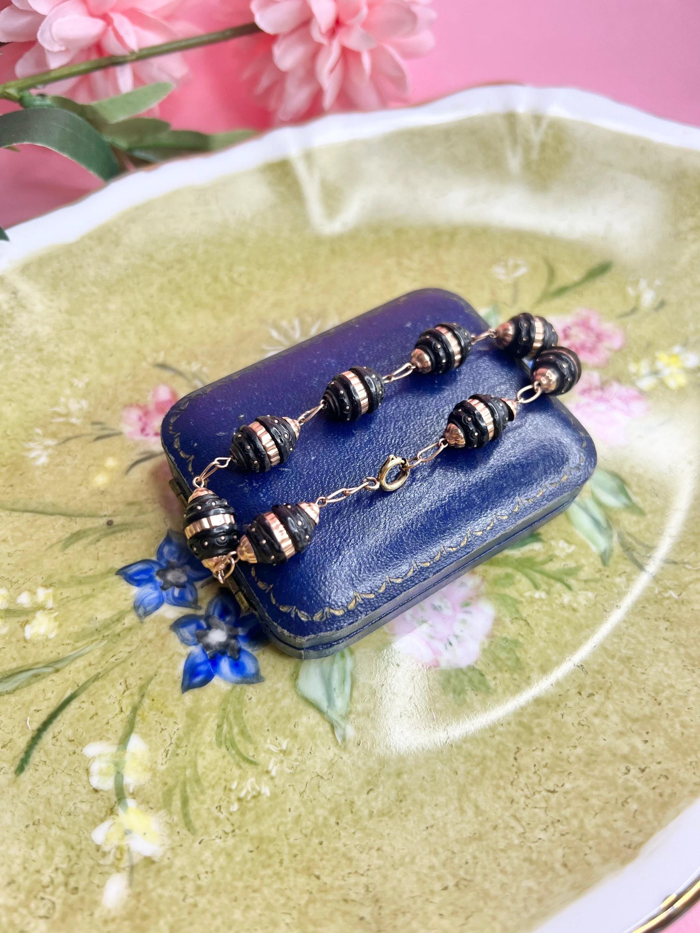 Antique Pique Bracelet 

9ct Rose Gold 

Circa 1880 

Fabulous Victorian Pique (Tortoise Shell) Bracelet. Beautiful ‘Beehive’ Shaped Links, Inlayed with a Rose Gold Band & Pretty Little Dots. 

Measures Approx Length 7 3/4 Inches & Width 9mm 

All