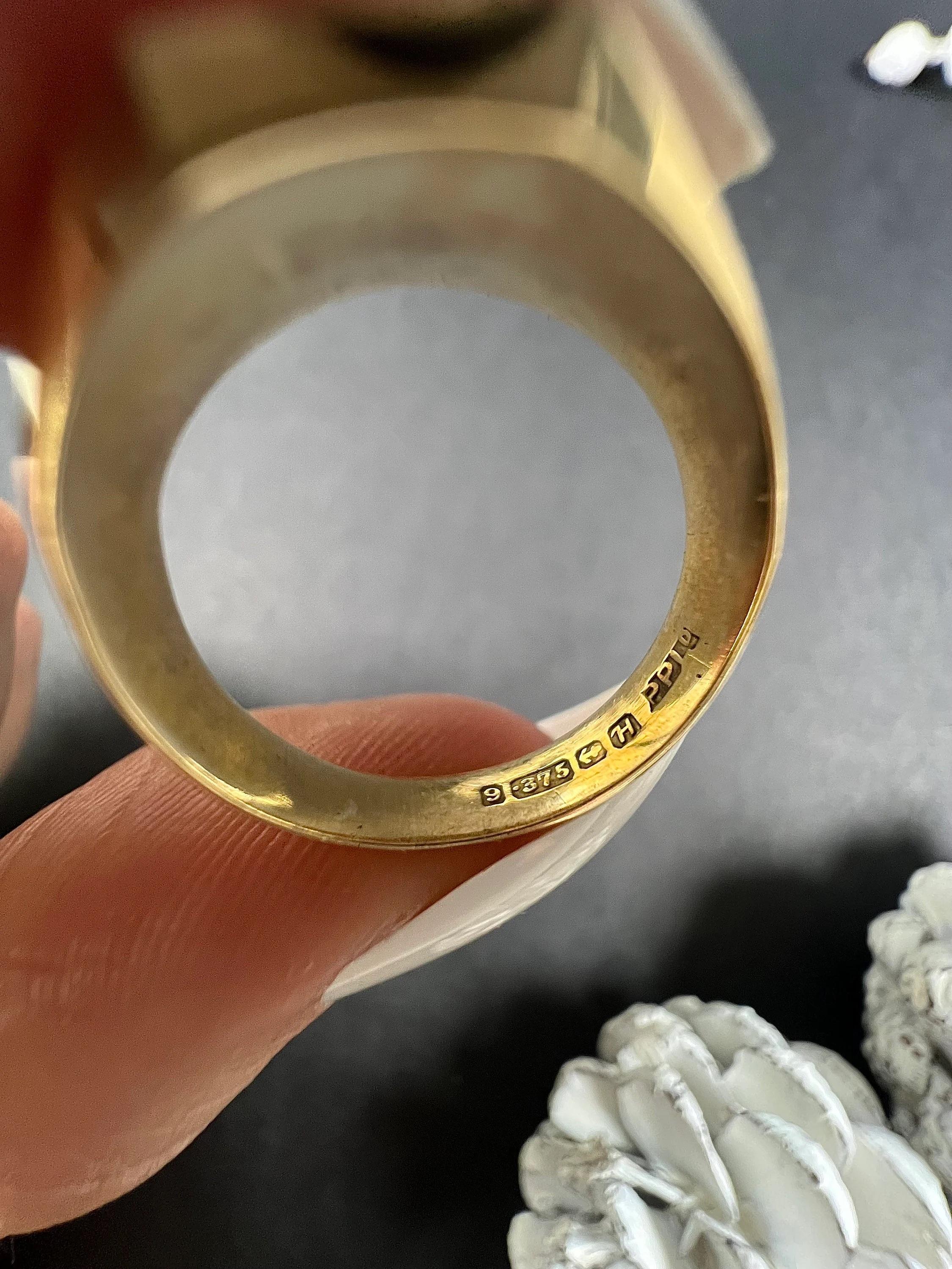 Vintage Signet Ring 

9ct Gold Stamped

Hallmarked Birmingham 1957

Makers Mark P P LD 

This vintage signet ring exudes a classic charm that is hard to miss. Made of 9ct yellow gold, it features an elegant octagonal-shaped surface that offers a