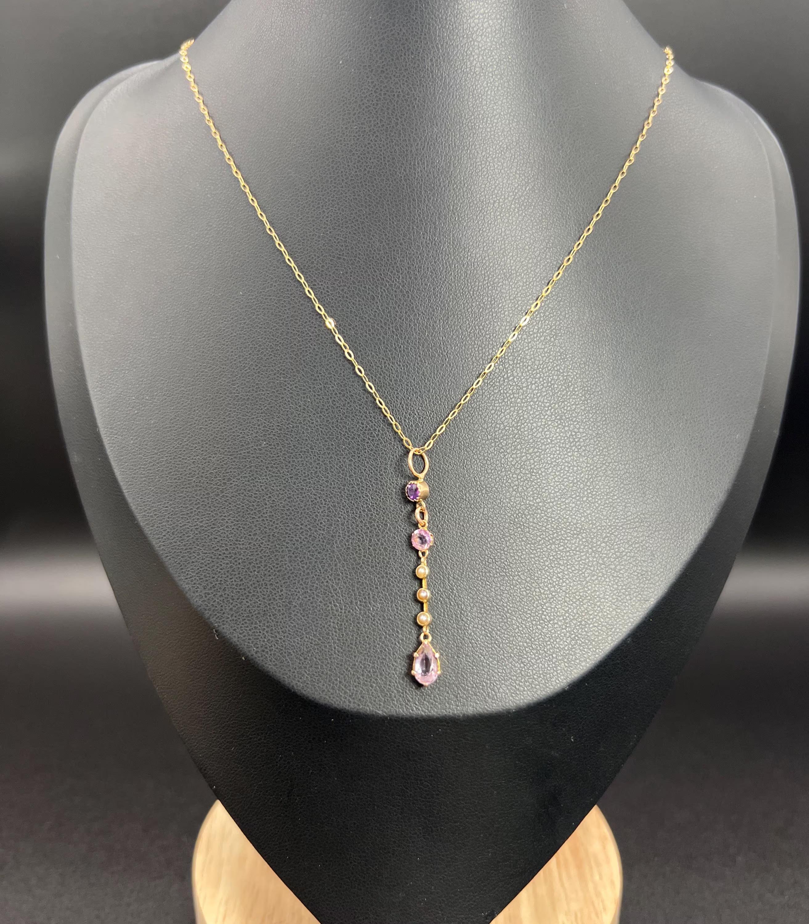 Antique Amethyst Pendant 

9ct Gold Yellow Gold

Circa 1900

Introducing our exquisite 9ct Yellow Gold Edwardian Pendant, a stunning piece that captures the elegance of the era with its fabulous long drop design. This enchanting pendant features two