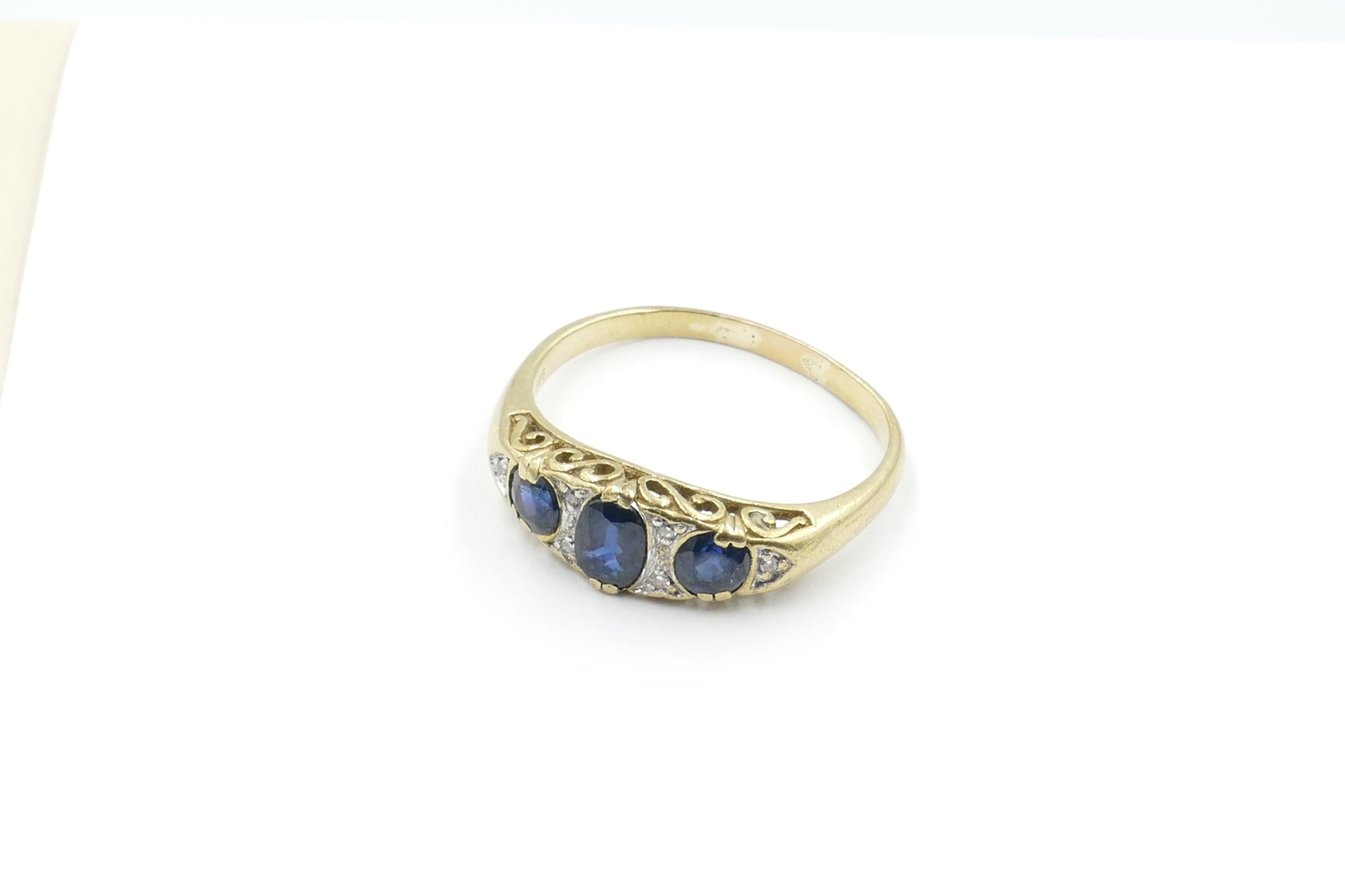 This beautiful, well preserved Late Victorian Ring consists of 3 deep blue Sapphires, Clarity eye-clean, Oval Cut, Claw Set, along with 6 Round Brilliant Cut Diamonds, Grain Set over White Gold, Colour J-K.
The Band is polished, half round, reverse