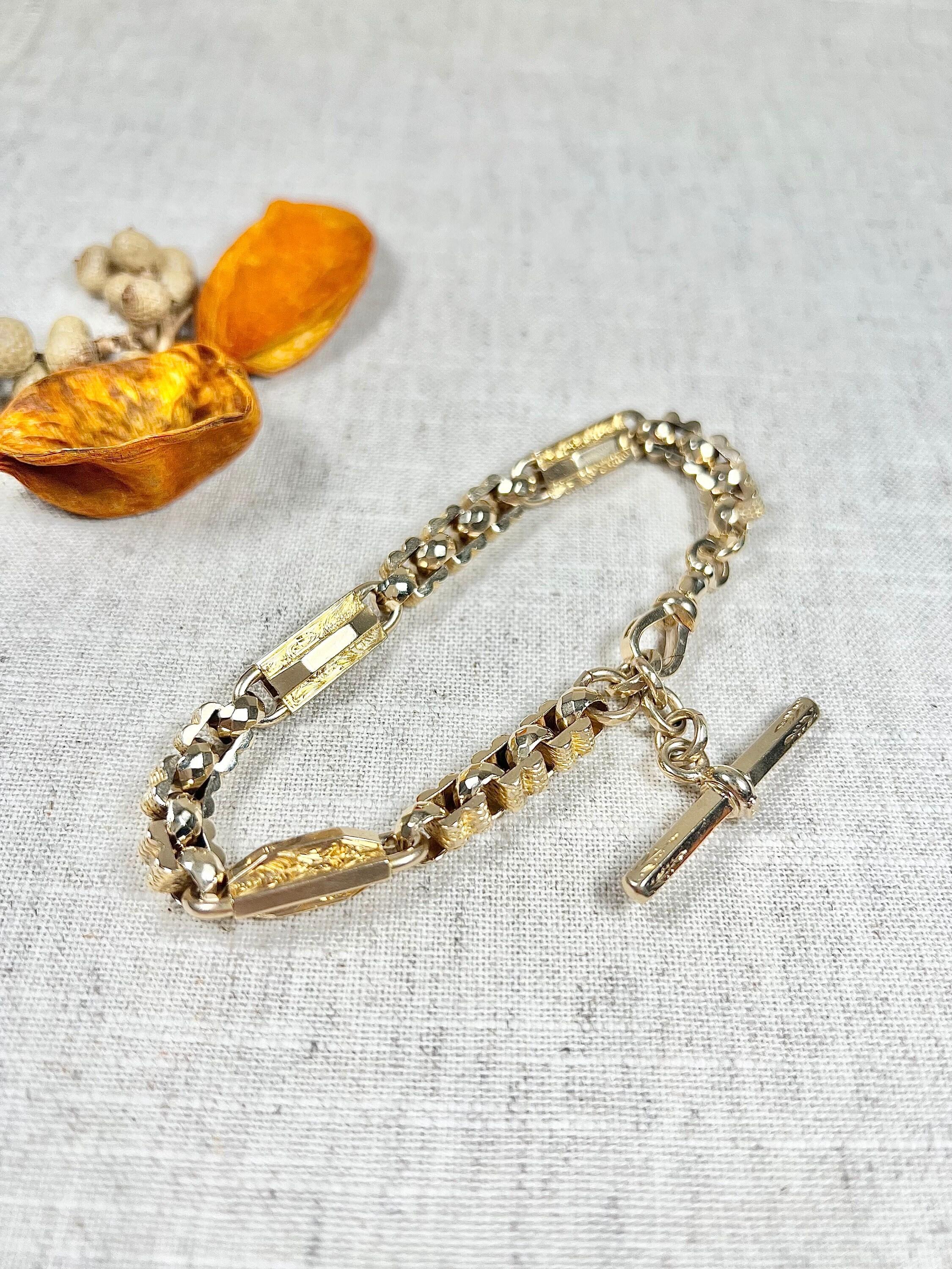 Antique Albert Bracelet 

9ct Yellow Gold Stamped

Circa 1880

Makers Mark Mc C & C

This exquisite 9ct yellow gold Albert bracelet is a true masterpiece. Featuring a beautiful set of elongated engraved links and square links, this fancy link