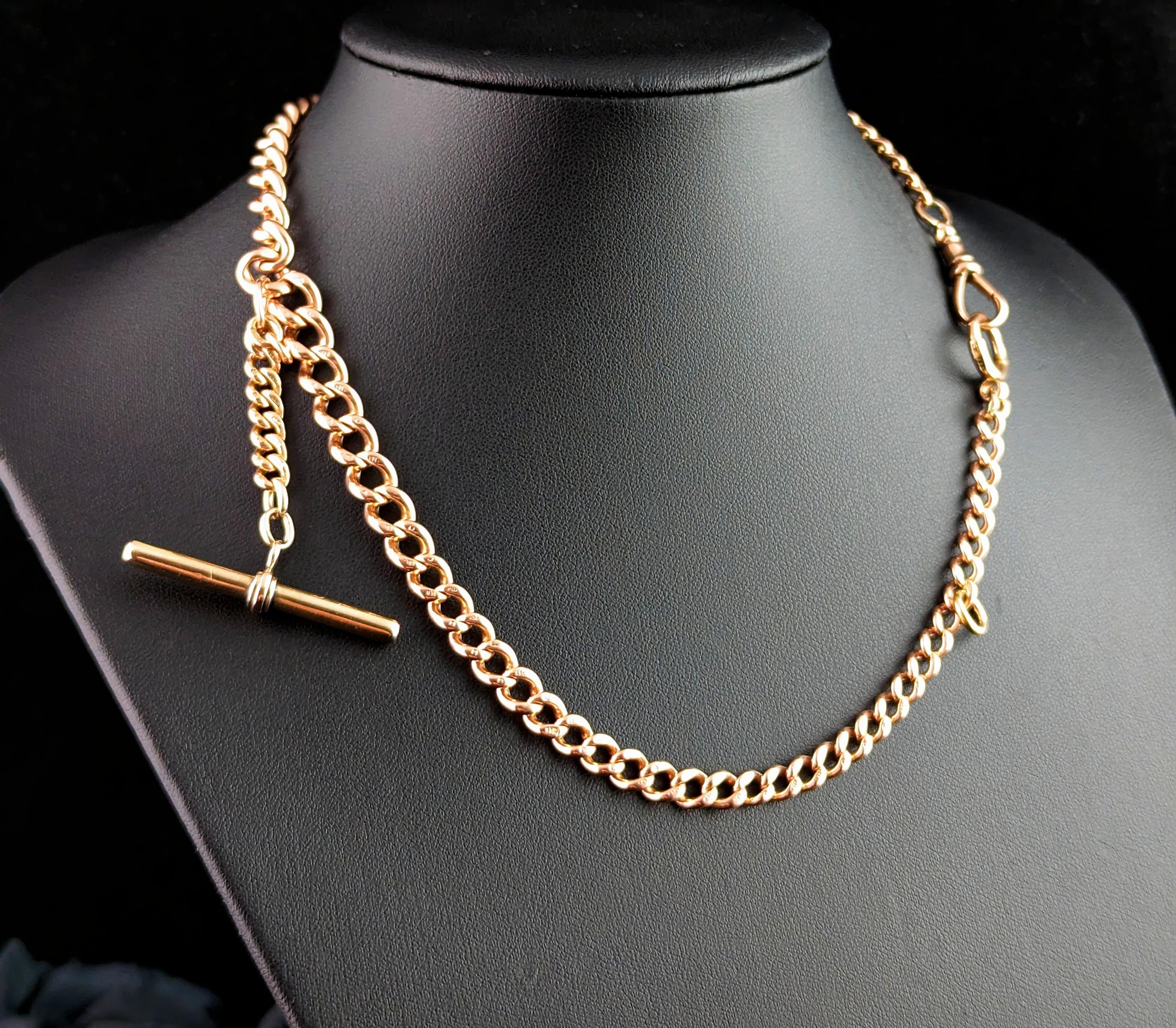 You are sure to be charmed by this handsome antique Edwardian era 9kt Rose gold Albert chain.

It is a curb link chain in 9kt Rose gold, each link individually stamped for 9ct gold, 9.375.

A double Albert with a graduating curb link width adjoined