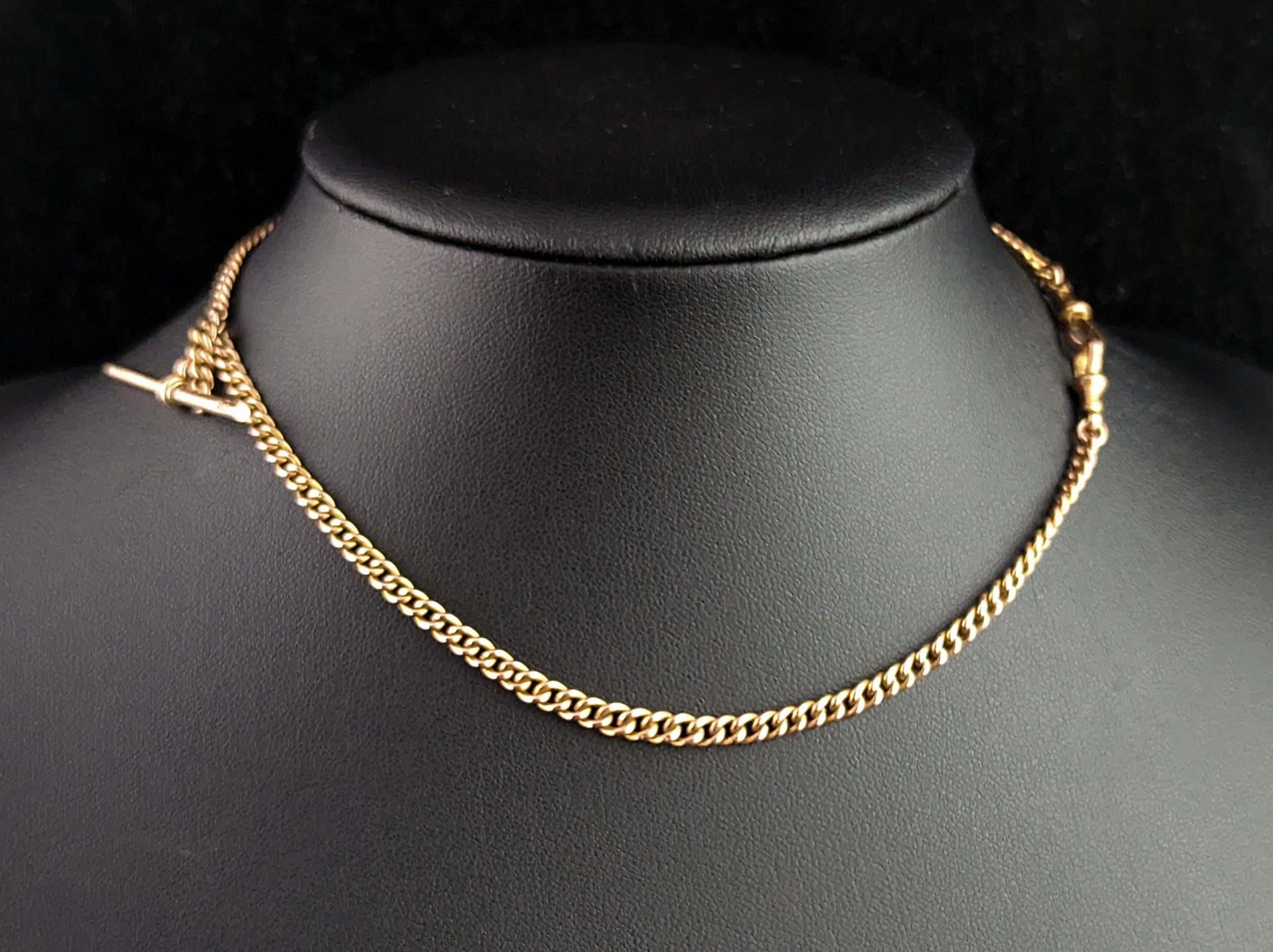Ahh the classic gold Albert chain! Such a beautiful and versatile piece of jewellery and always highly sought after.

This is a shorter length Albert chain in a rich yellow gold with a tight curb link, early Art Deco era c1910s, it would have graced