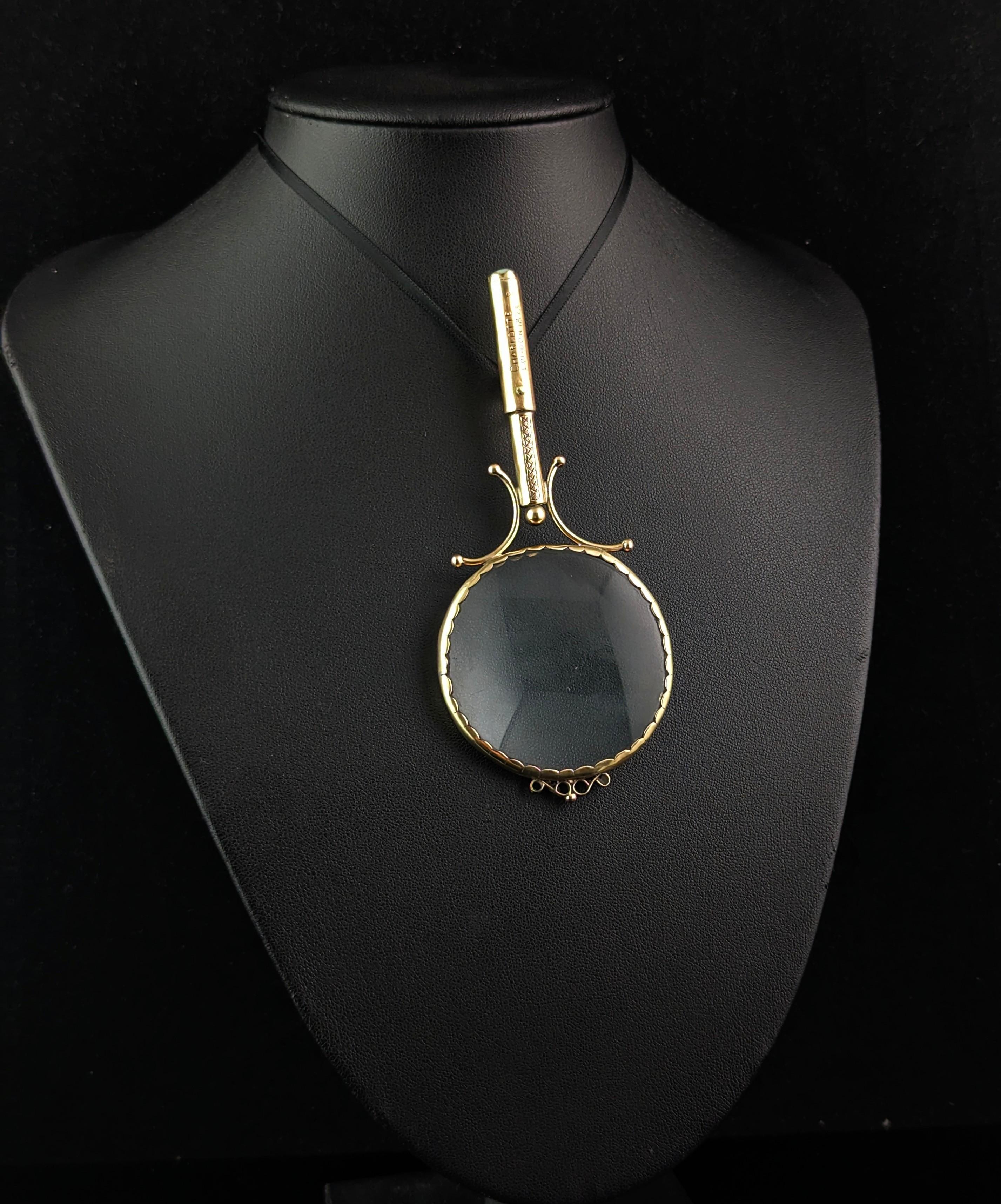 A magical antique 9ct gold opal set magnifying glass pendant.

It is a larger piece much larger than say a quizzing glass and is more the size of a traditional small magnifying glass, it has the original heavy glass lense, perfectly preserved in