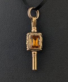 Antique 9k gold cased watch key pendant, Foiled Paste and Sardonyx