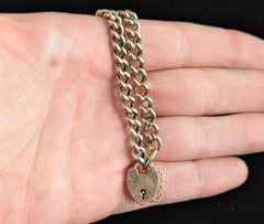 Antique 9k gold curb link bracelet, Heart padlock