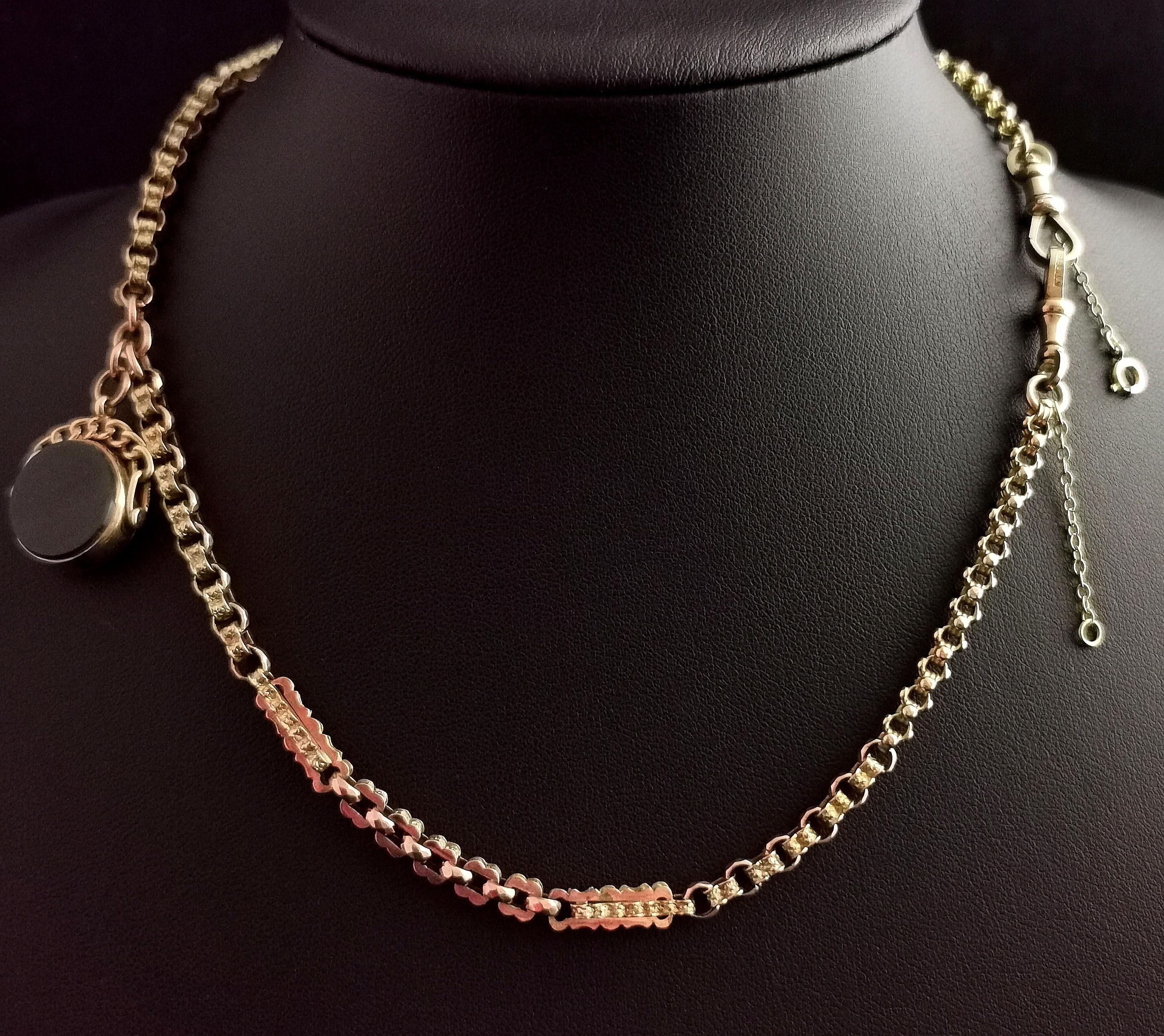 A gorgeous antique 9kt gold, fancy link Albert chain.

It has lovely fancy rich solid gold links with very slight rosey tones, the links are two different types with an interlocking bar and square links joined with faceted rolos, such a gorgeous and