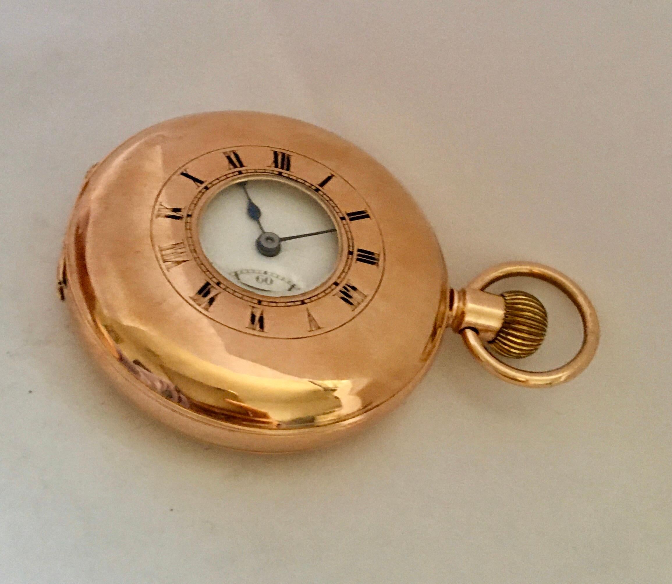 This beautiful pre-own half hunter gold pocket watch is in good working condition and it is running well. Visible signs of ageing and wear with light and tiny scratches and dents on the gold watch case and some Roman numerals on the top cover has