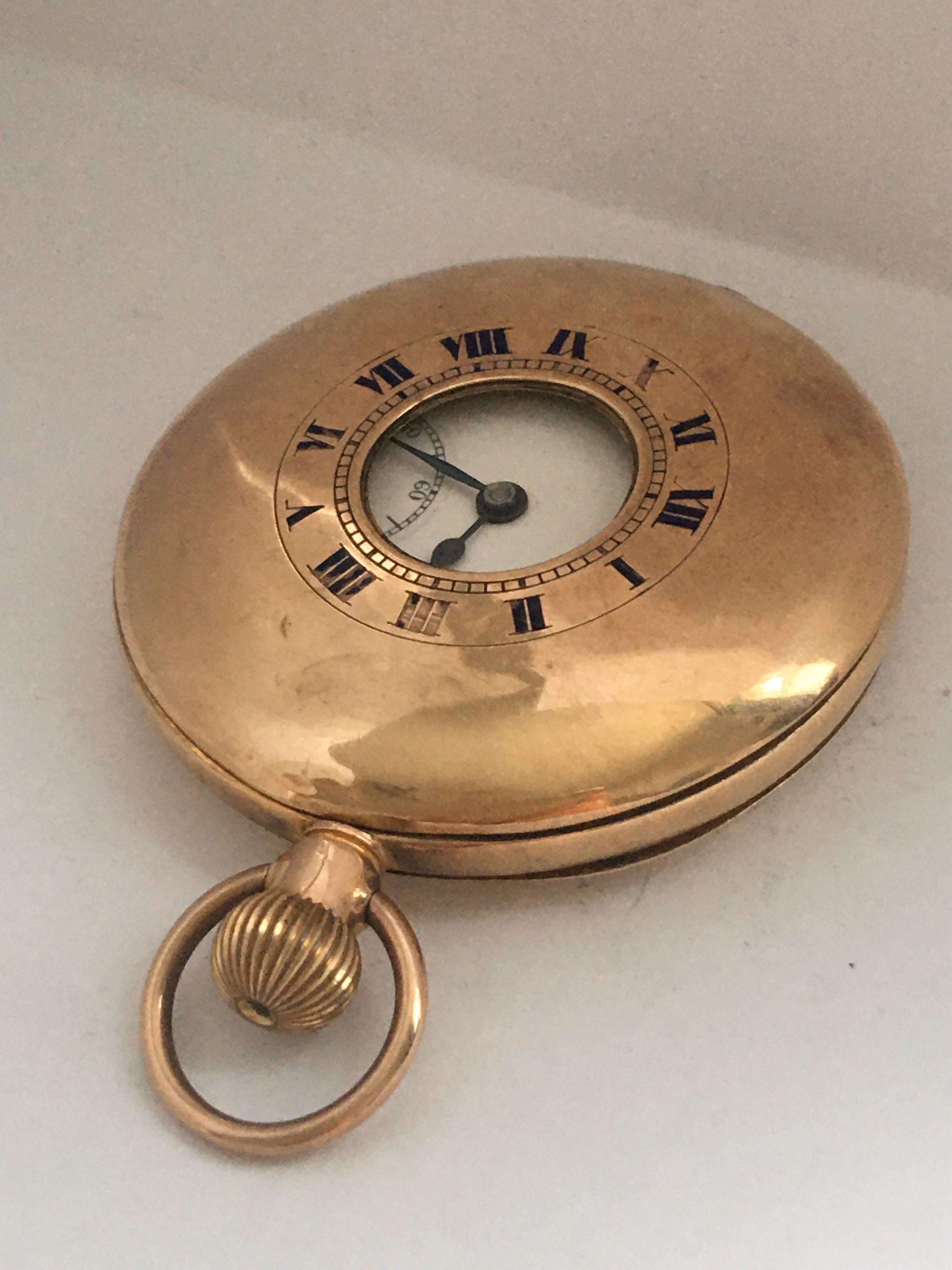 This stunning 50mm diameter half hunter 9K Gold Pocket Watch is in good working condition and it is ticking well. Visible signs of ageing and wear with tiny dents, scratches on the case as shown. Some Roman numerals on top cover are a bit fade as