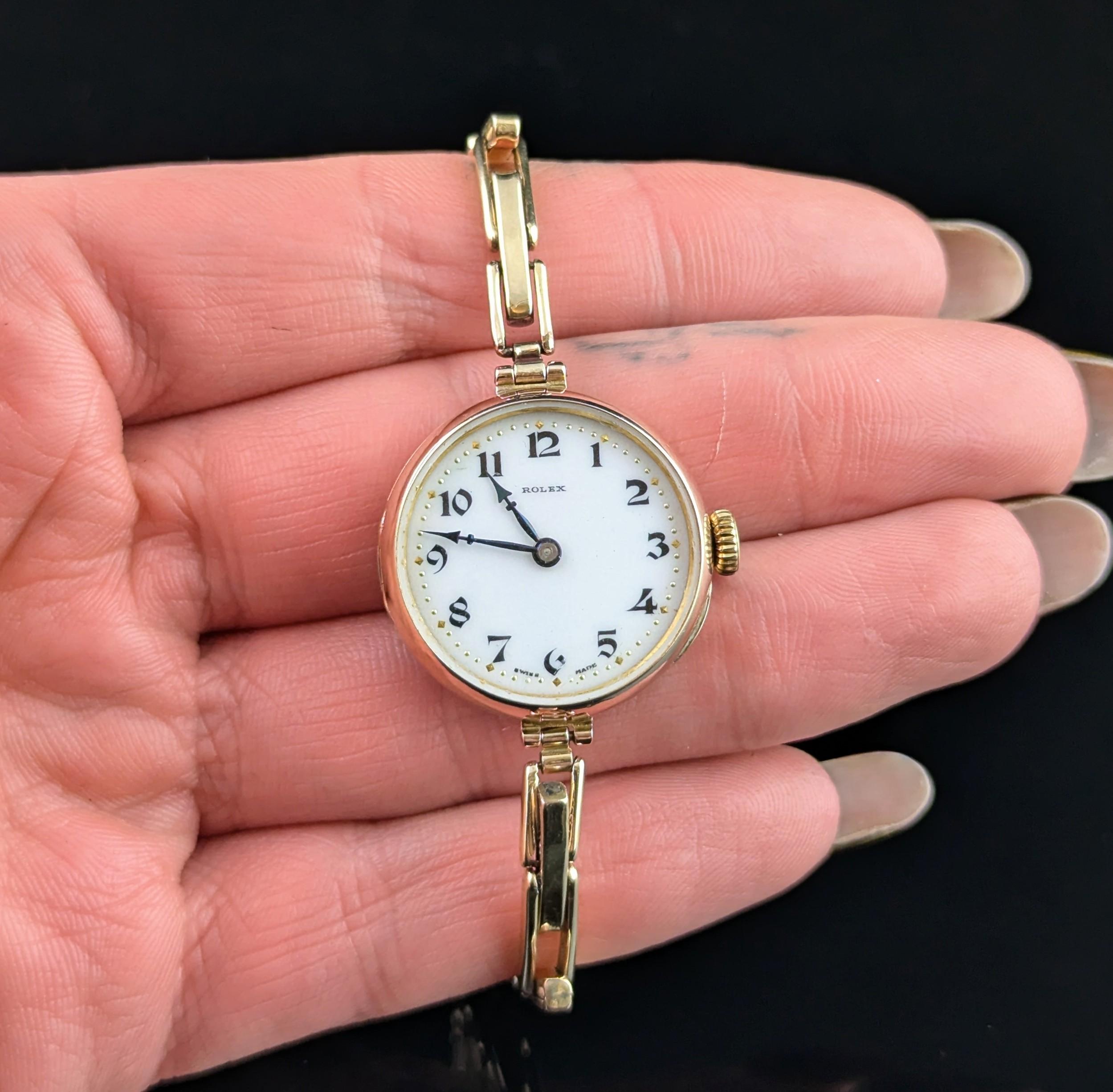 The perfect classic timepiece is what you wil find with this antique ladies 9ct gold Rolex wristwatch.

It features a circular shaped case in 9ct gold marked on the outer case and internally hallmarked, the watch has a white enamel dial and is