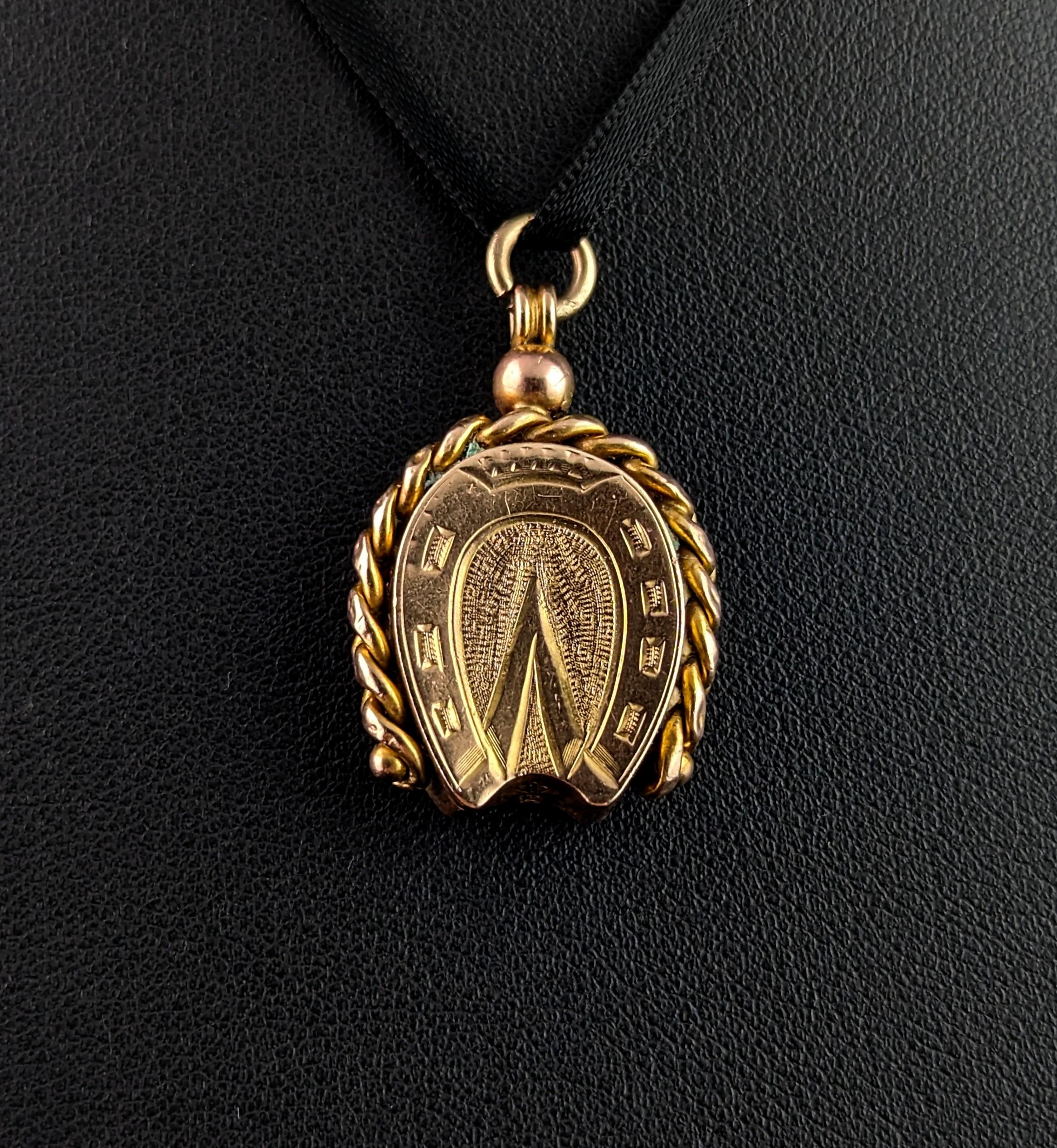 This gorgeous antique novelty gold seal fob pendant is so much fun!

Beautifully modelled as a horseshoe and hoof print with a fancy curb link design encompassing the fob in rich 9ct yellow gold, the reverse is set with a smooth polished Bloodstone