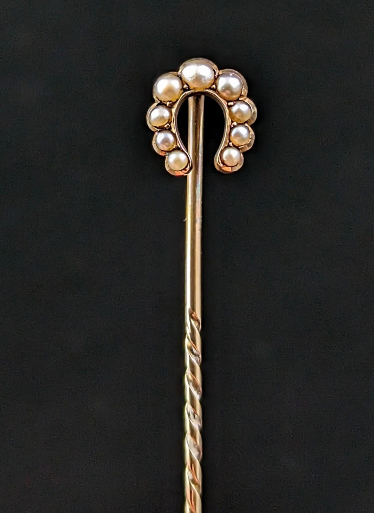 An attractive antique 9ct gold and cultured pearl stick pin.

A 9ct yellow gold stick pin with a horseshoe shaped terminal set with creamy seed pearls, this is a really classic design and will add a little touch of good luck to any outfit!

The