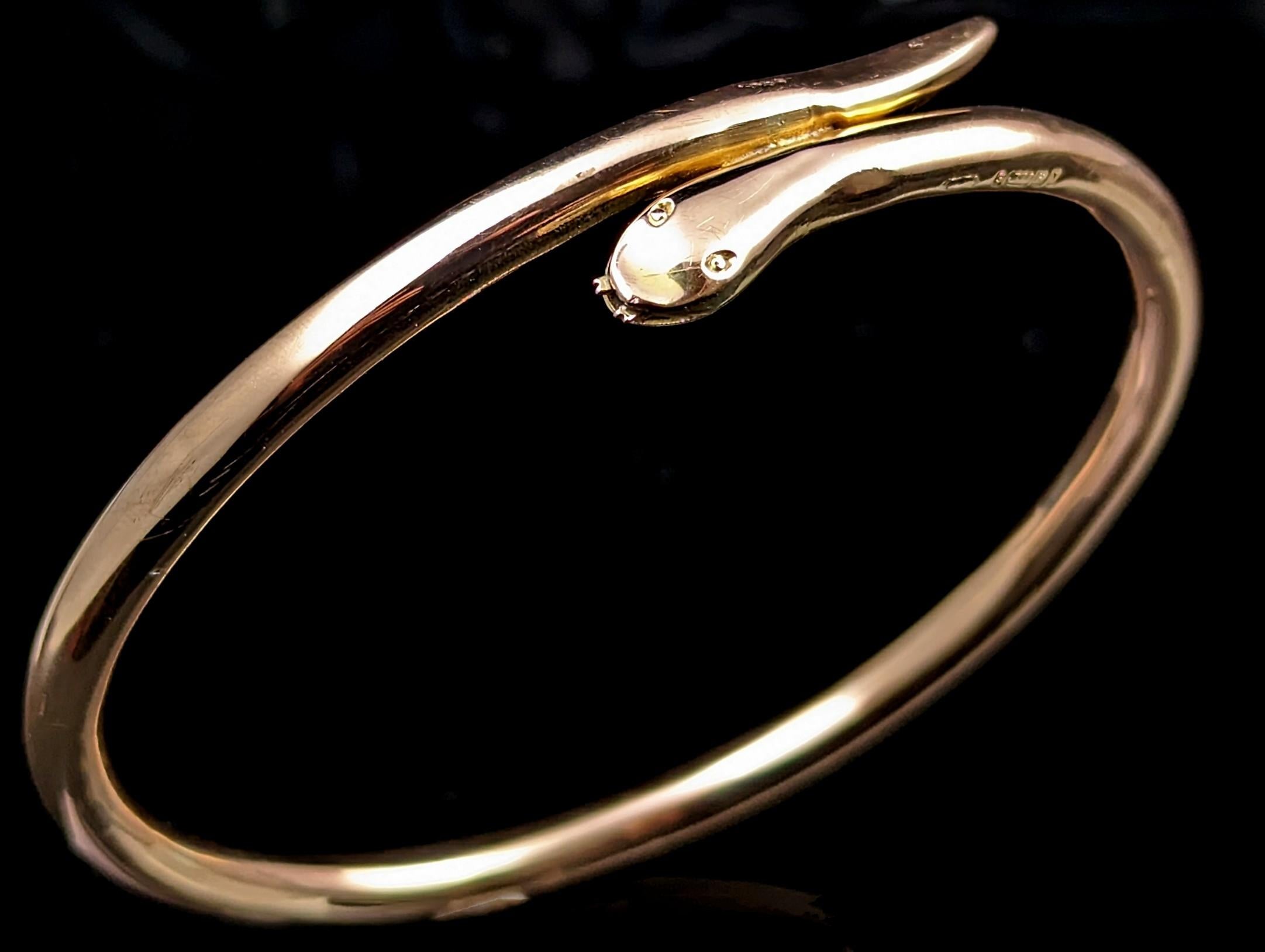 Whoever takes home this amazing antique 9kt gold snake bangle will not be disappointed!

This spectacular piece is an upper arm bangle, designed to be worn higher up on the arm and made at the height of the Art Deco Egyptian revival period and this