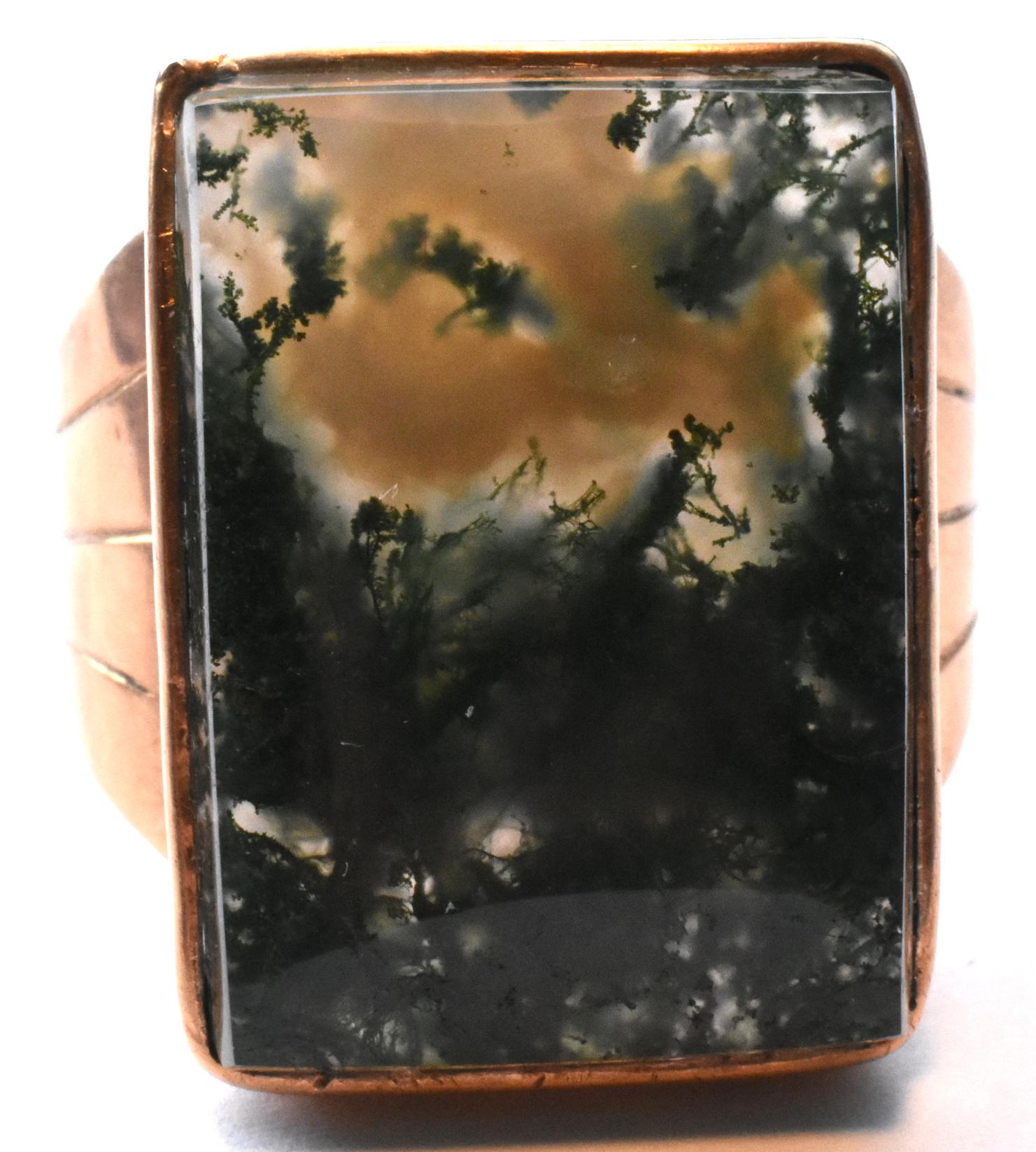 Substantial moss agate ring in 9K gold, this ring makes quite a statement with its bold rectangular shape and imposing shank. Moss agate was made popular by Queen Victoria after the Royal purchase of Balmoral Castle in 1948. English society was