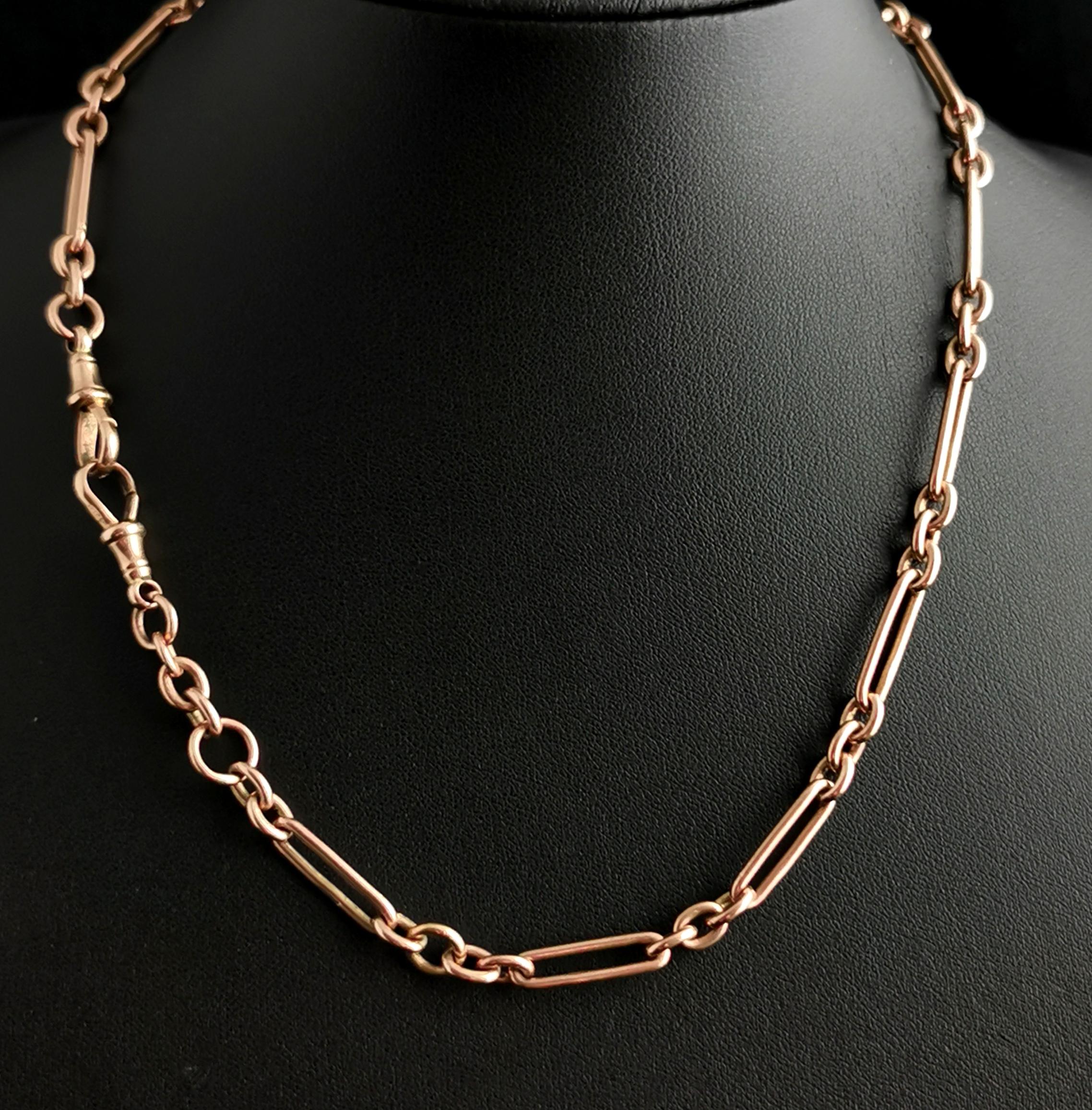A gorgeous antique Edwardian era 9ct rose gold fancy link watch chain or Albert chain, this is a longer length so could be used as a necklace.

It has fancy trombone links connected with rich rosey gold o rings each stamped 9.375.

It has two gold