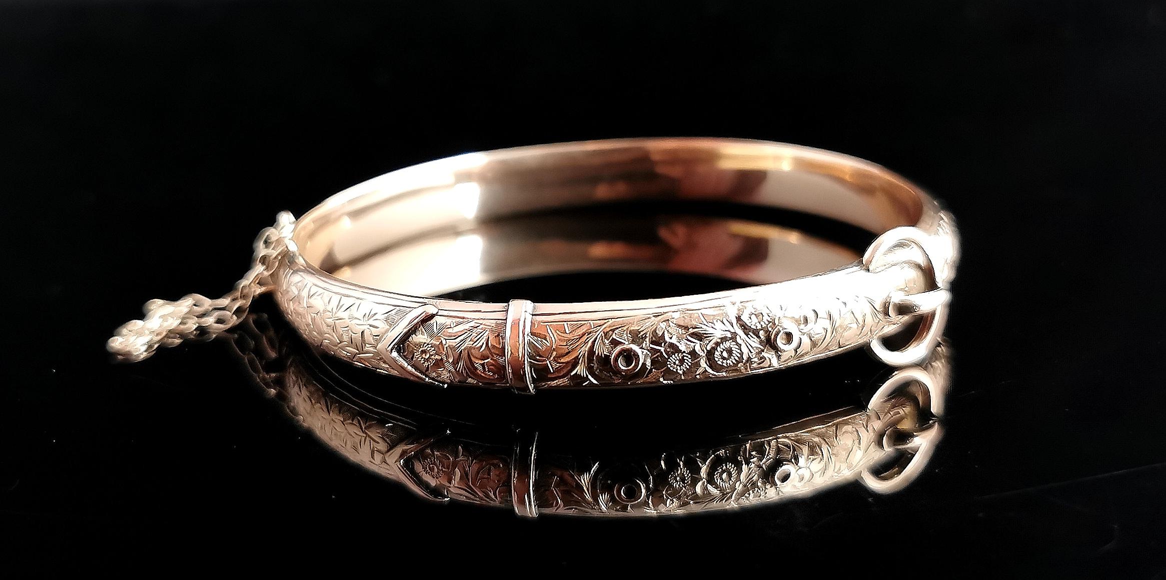 A superb antique Edwardian 9kt Rose gold gold, floral and leaf engraved buckle bangle.

A very pretty design with a slim plain polished back.

The front is engraved with an elaborate floral engraving featuring ivy leaves, symbolising the