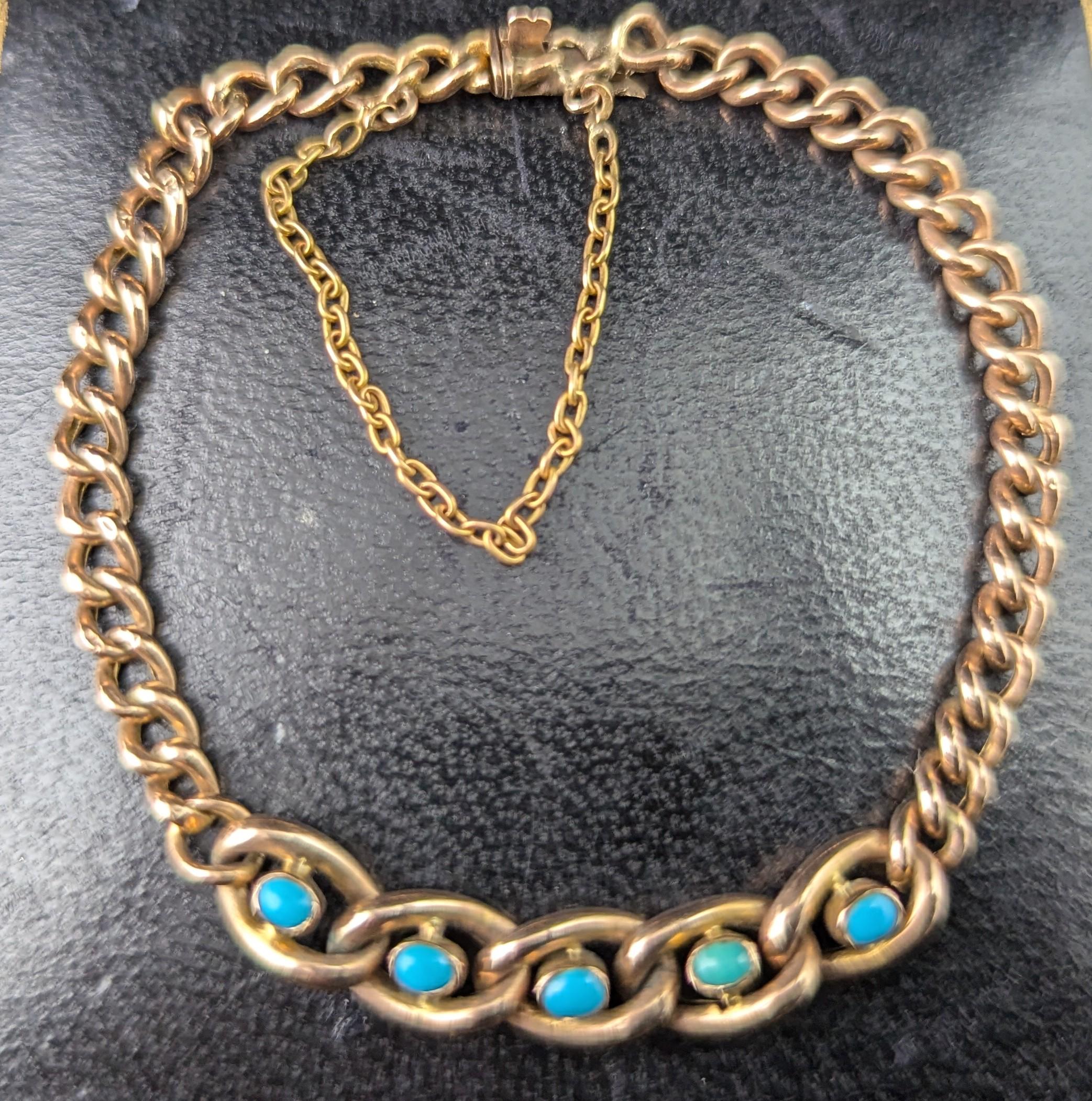 A stunning antique, Edwardian era 9ct gold curb bracelet with a Turquoise set oval link front.

Lovely rich 9ct rose gold curb links, the front panel featuring oval links each set with a turquoise cabochon to centre, the turquoise are slightly