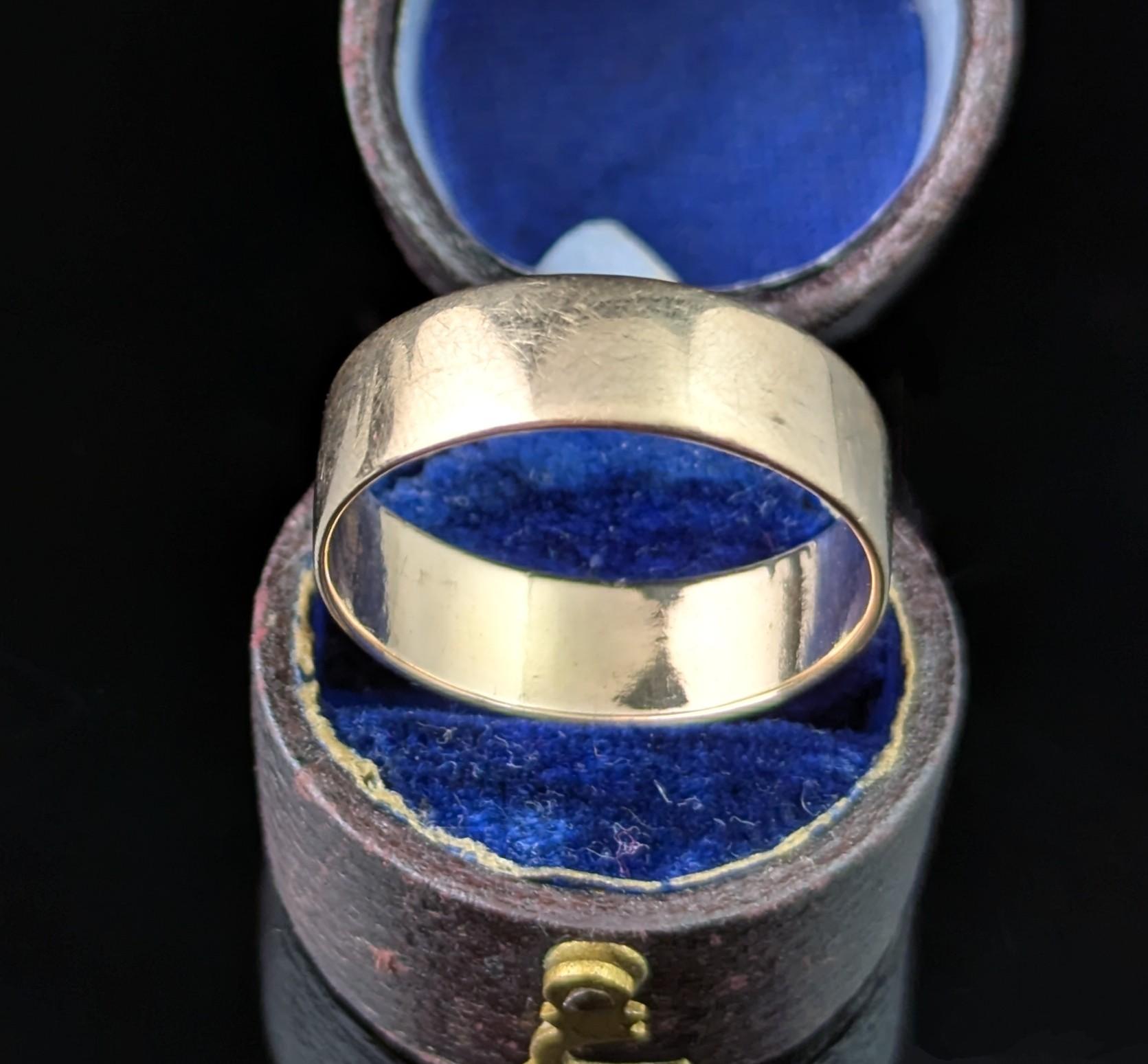 A gorgeous antique 9ct gold band ring.

It is a nice chunky cigar band style ring with a rich rose tone to it.

Perfect as a stacker or keeper ring as well as for its intended purpose if a wedding ring.

The gold is lovely and smooth, it has been