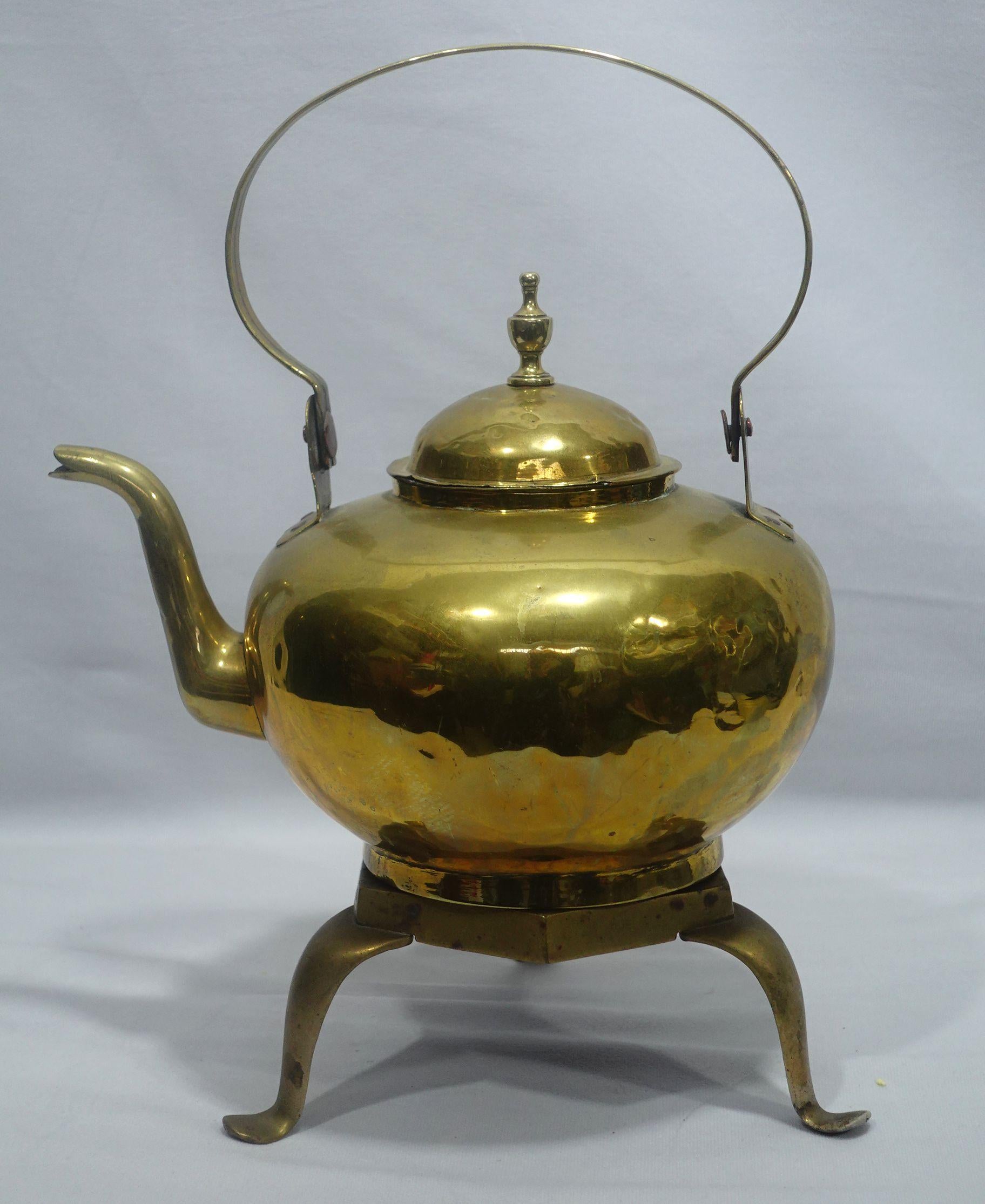 Hand-hammered a brass tea kettle wit a brass trivet made in England from the 19th century, very well hand-made with delicate craftsmanship, and highly collectible antique.
Dimensions:
Teapot: 11