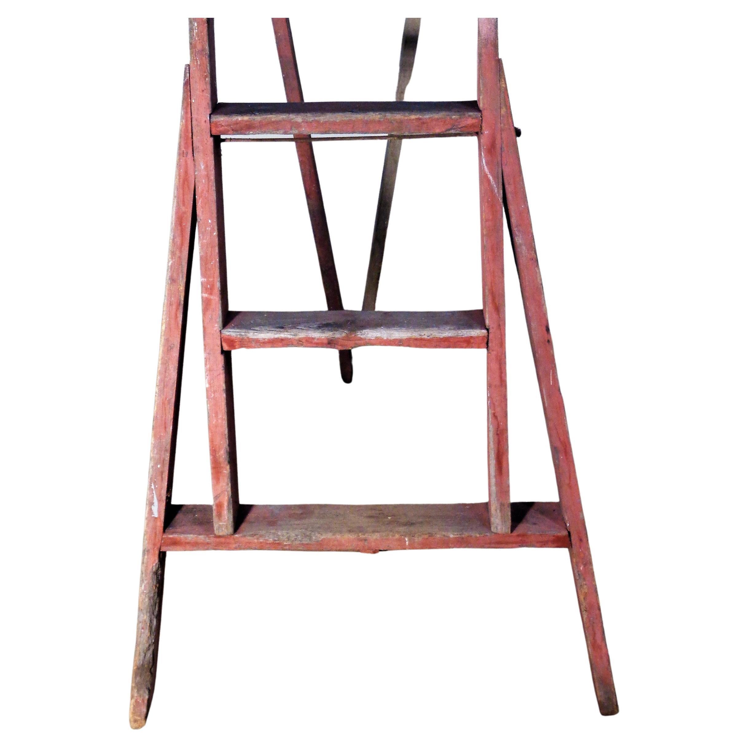  Antique A frame wood and iron apple picking orchard ladder in beautifully aged original red paint washed surface / iron riveted bolted / hand crafted dowel pegged wood construction / signed with name of orchard - G. Aldrich, North Rose NY. Circa