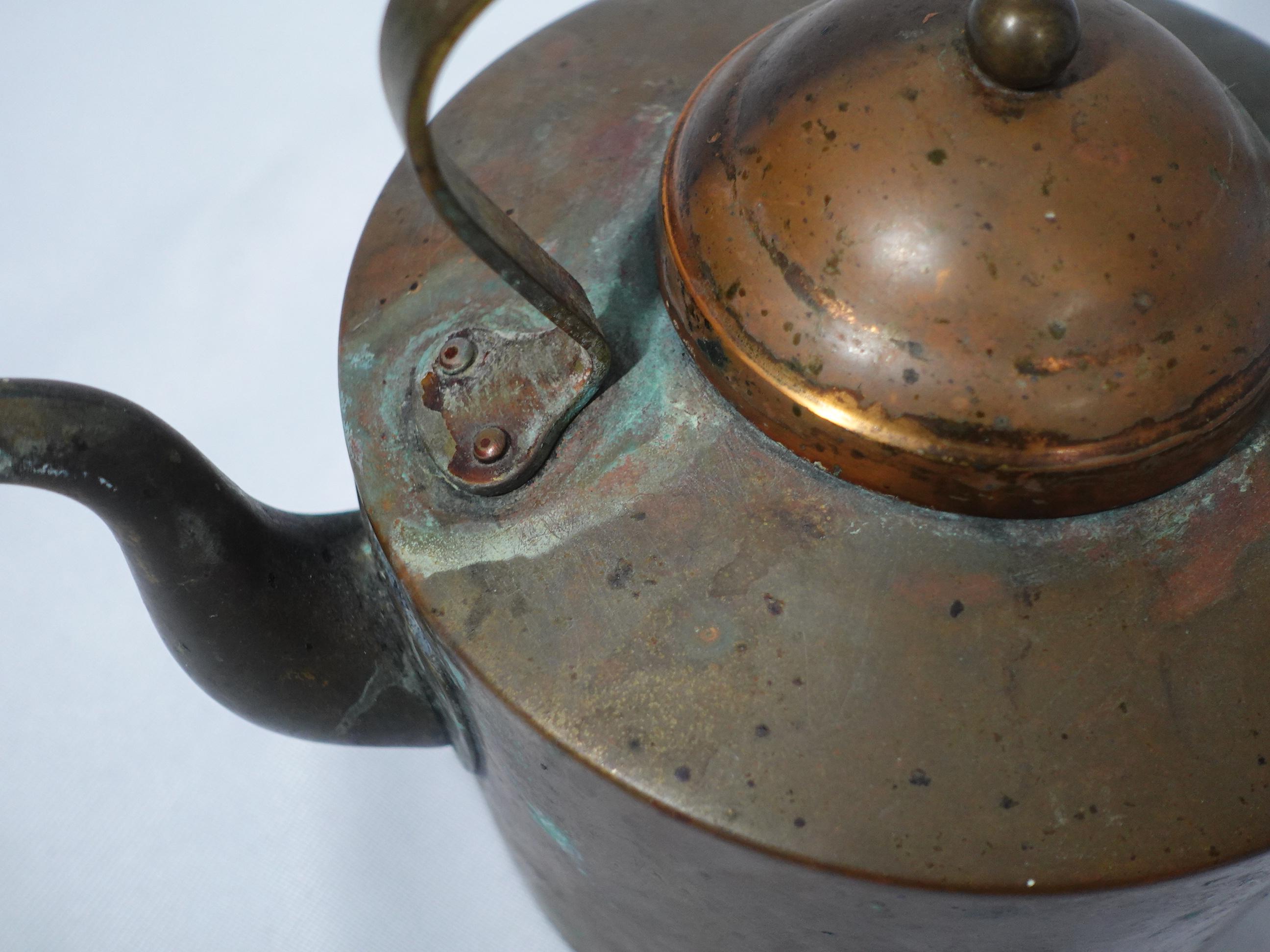 vintage copper tea kettle with wood handle