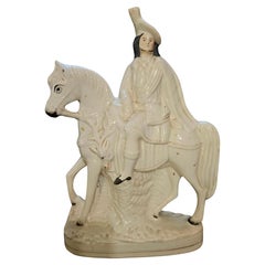 Figurine antique en faïence de Staffordshire représentant un grand chasseur des Highlands écossais du XIXe siècle
