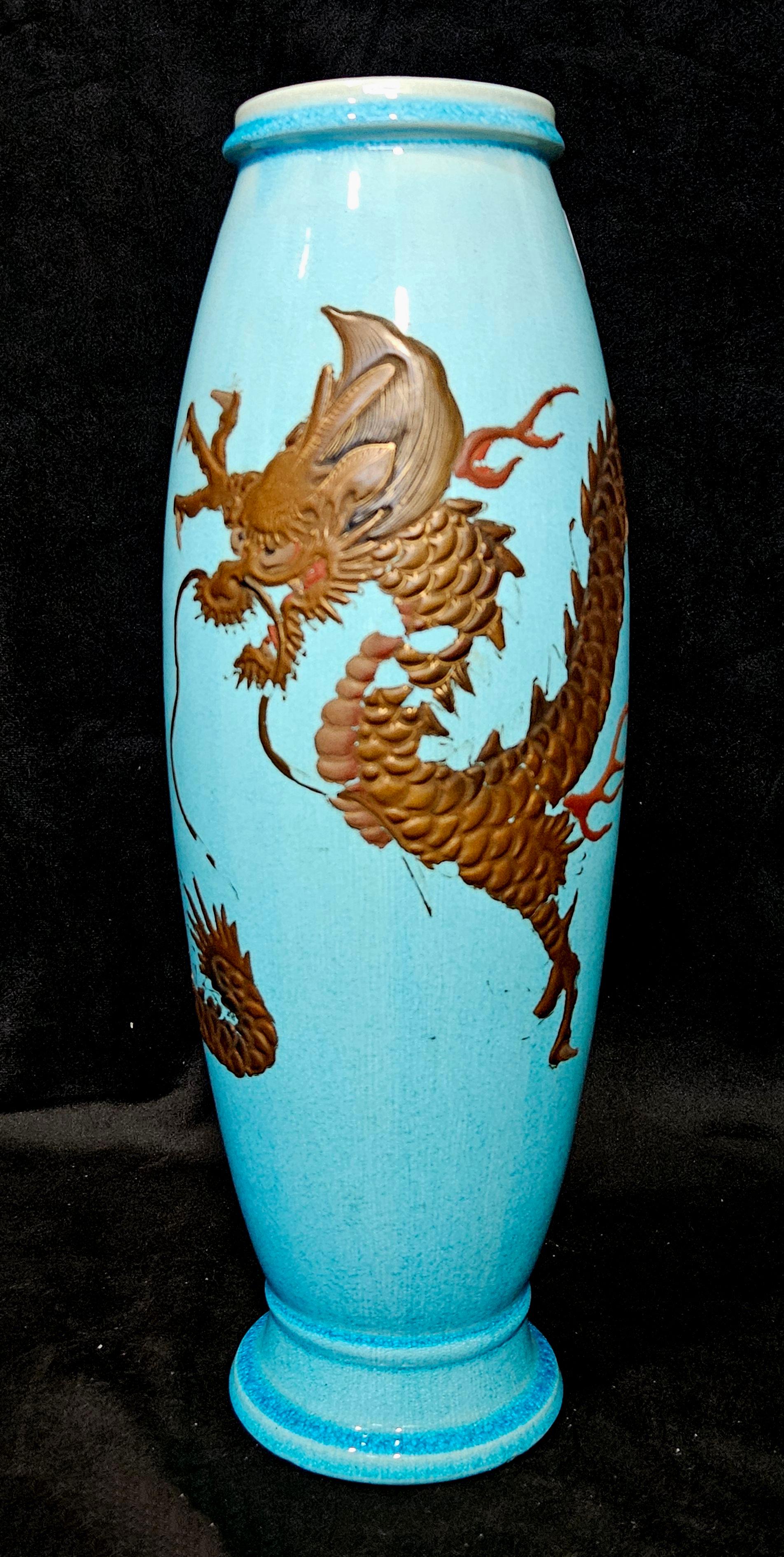 Lacquer dragon applied to a light blue ground, circa 1900. Signed 
