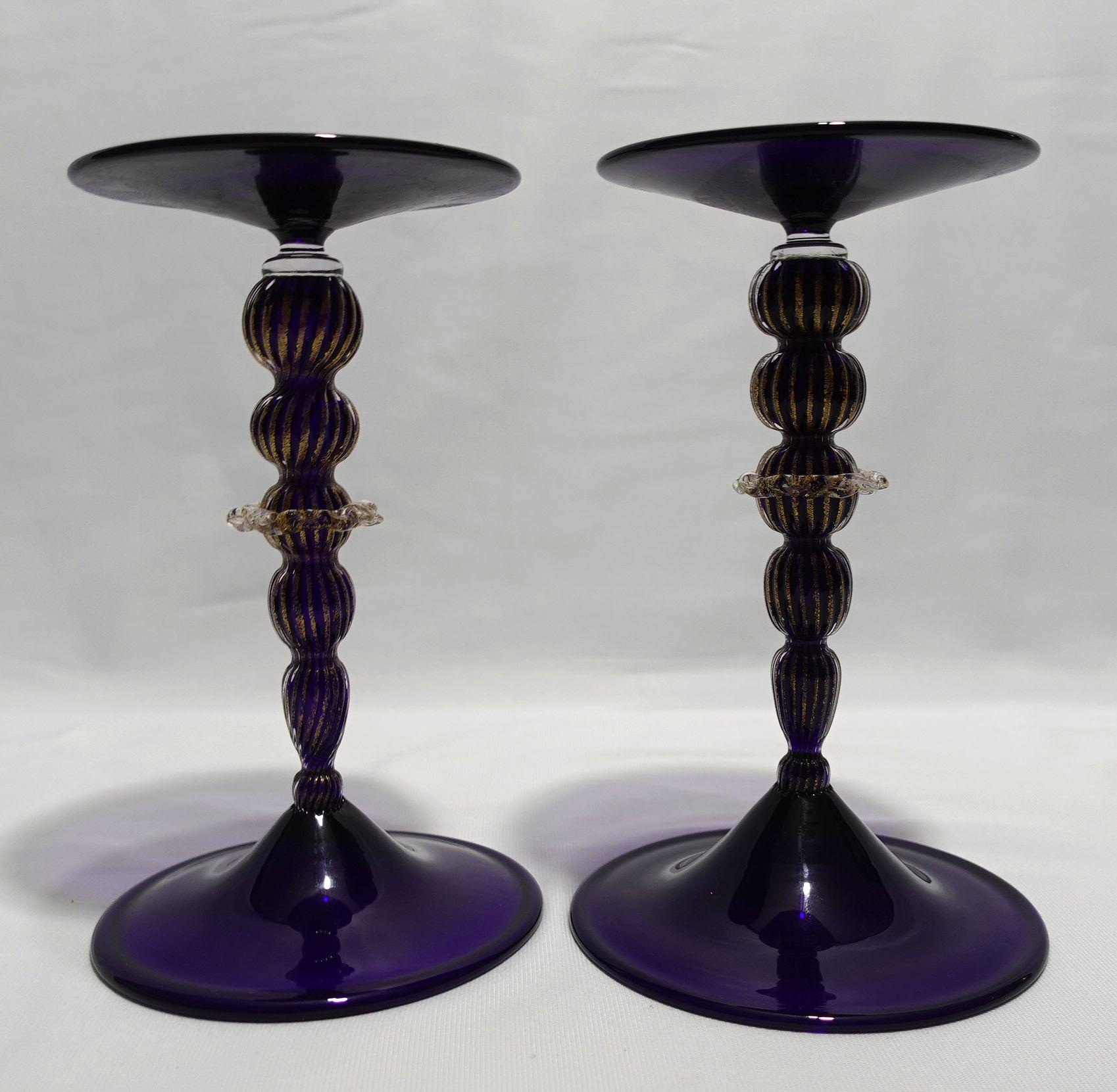 Antique A Pair of beautiful Blue Glass Candle Sticks with unique shapes of columns in the style of Murano.
illegibly signed, possibly Salviati. Both: 8