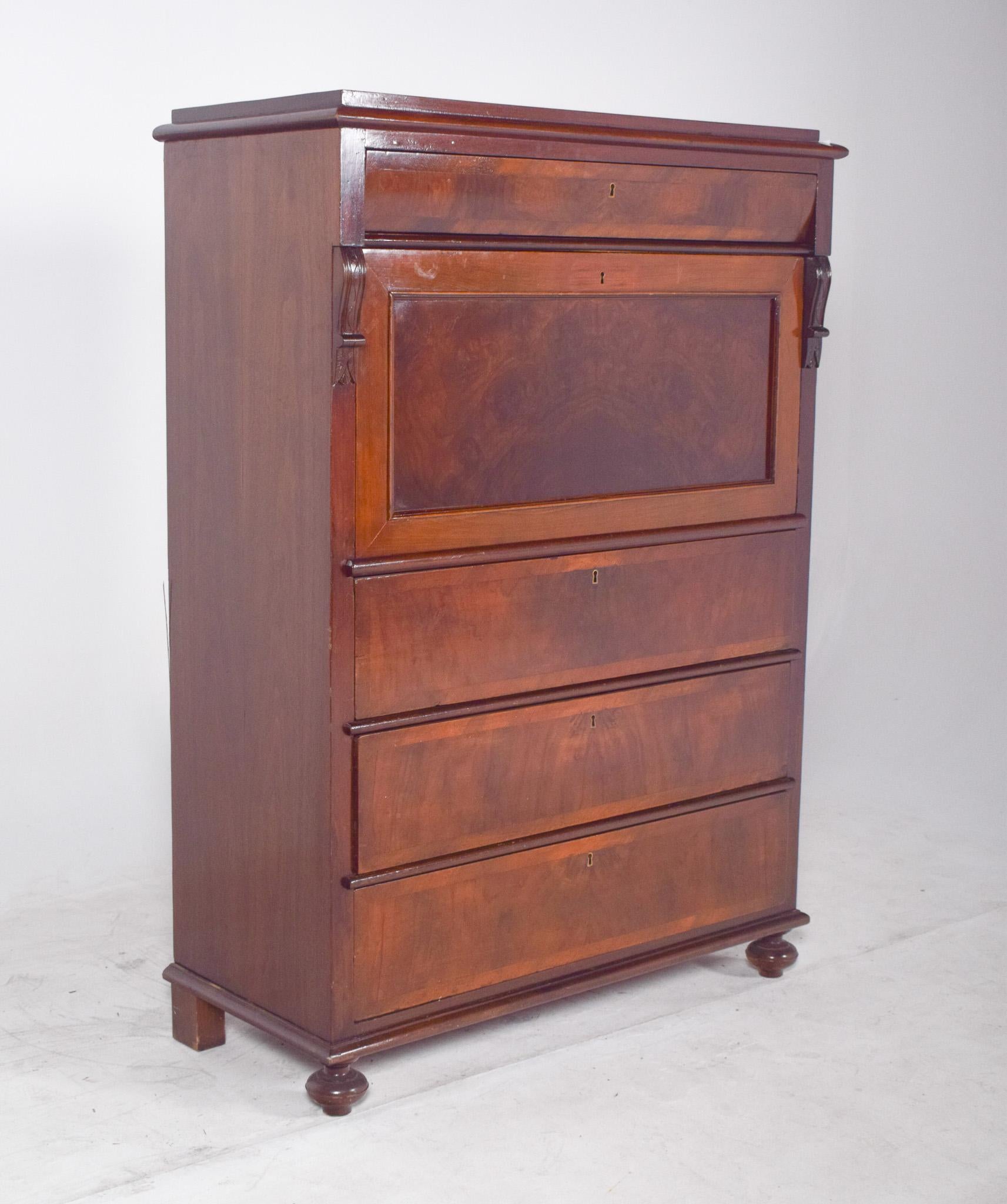 Abattant cabinet with three large drawers. With a hinged top, characteristic of 19th century European furniture. Made from noble wood with a varnish finish, it has striking natural veins and rich tones. The top has a compartment with several small