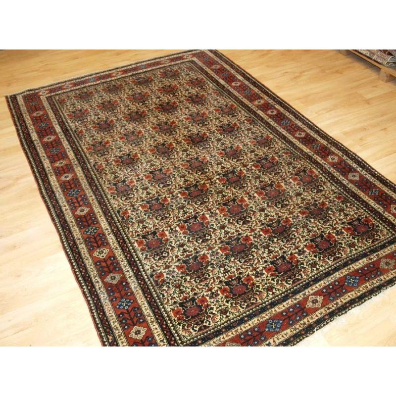 An antique Abedeh rug with the classic Zili Sultan ‘vase and peacock’ design with excellent soft colours on an ivory ground. The rug is of a larger size than is normally found of this type.

The rug is of fine weave and an excellent example of