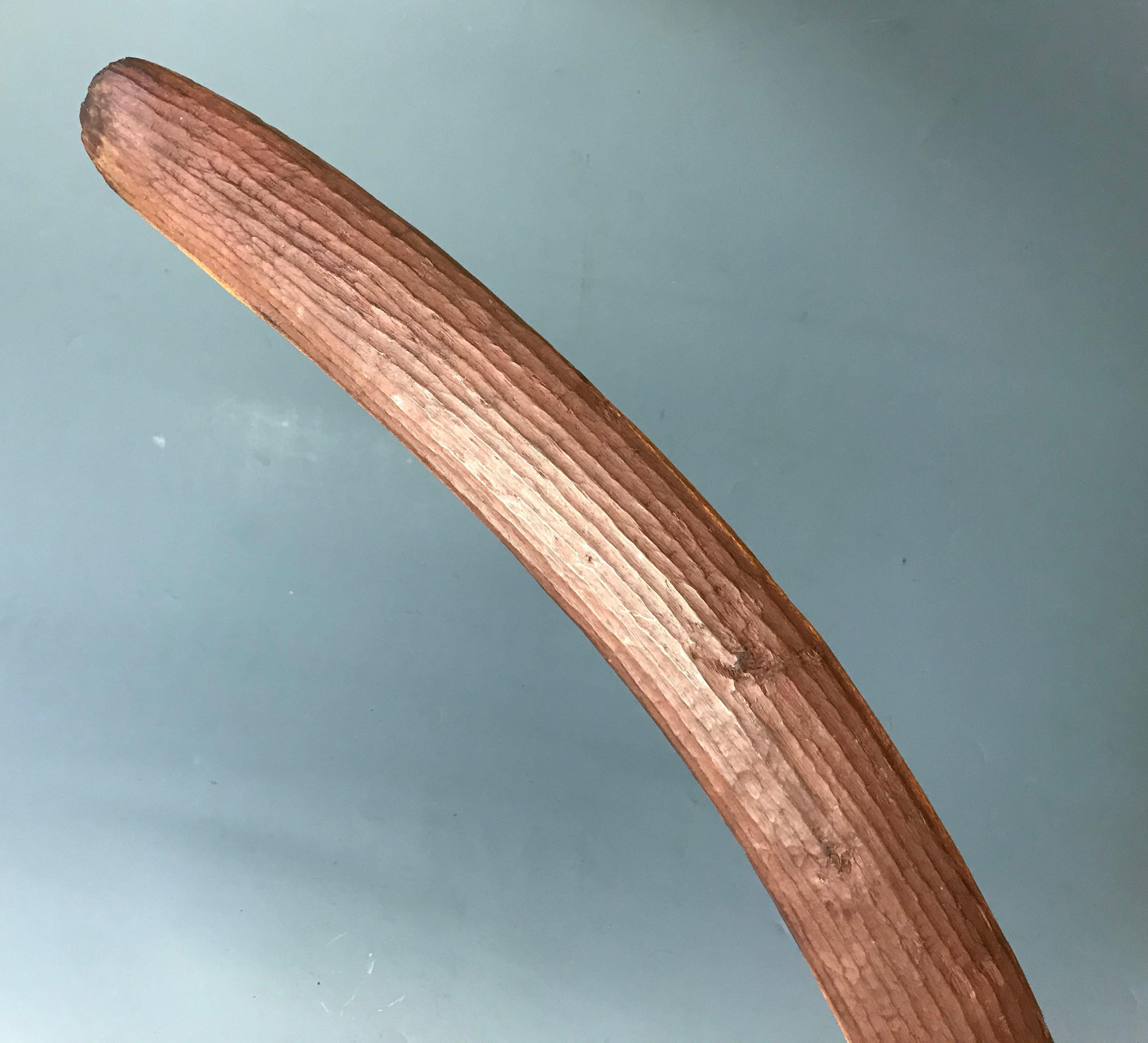 Very Good Antique Aboriginal carved wood Boomerang Australia 
Carved with fluted design on one face chip design on back, red pigment
Central desert region Australia
Original Tribal piece
Period early late 19th early 20th century
Measure: Length 85