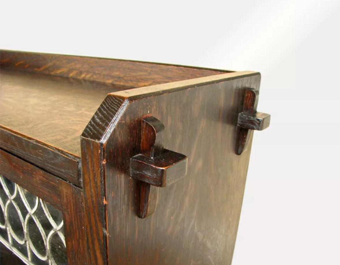 This is a Charles Limbert Bookcase (Model 321) from the early 1900s with 2 doors and leaded glass in excellent condition. Signed with an early Charles Limbert paper label on the back, numbered 