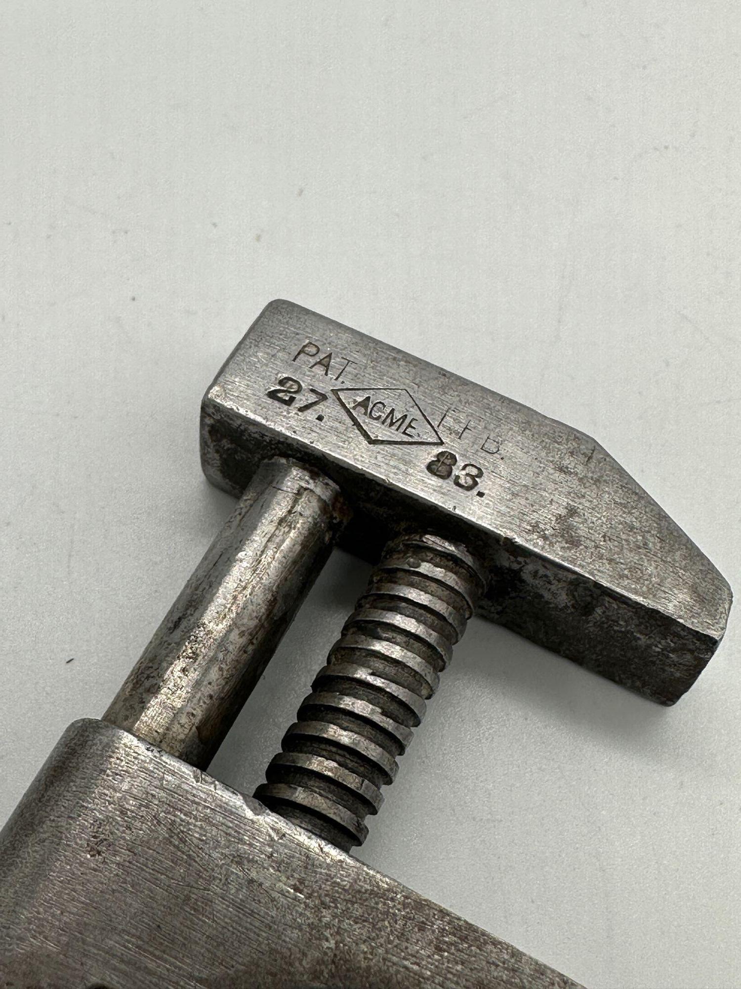 Antique Acme 5-inch Forged Adjustable Spanner Wrench featuring a Twisted Handle, patented by Frederick Seymour under Patent number 27.83.

The handle is constructed from a wire or rod bent to create two parallel rods. One of these rods is threaded