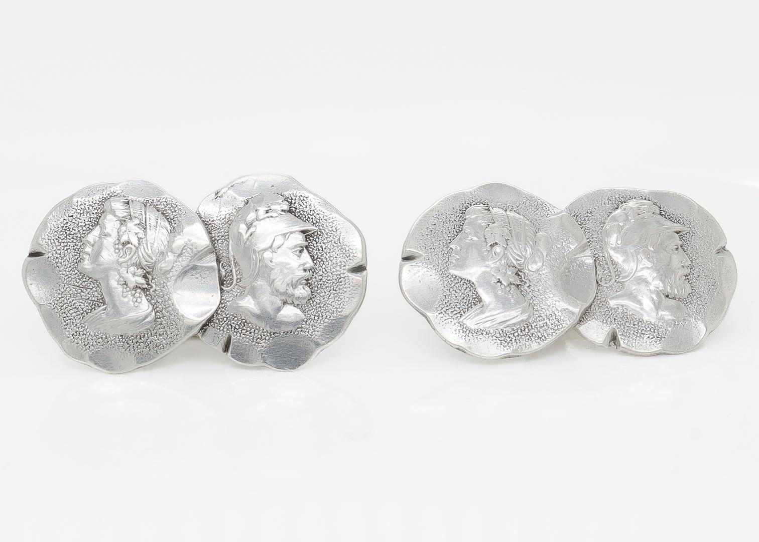 A fine pair of antique Etruscan silver cufflinks.

By the Acme Silver Co.

In the style of Shiebler & Co.

Each cufflink consisting of two identical Etruscan cameo medallions - a woman on the left and a helmeted man on the right.

Marked to the